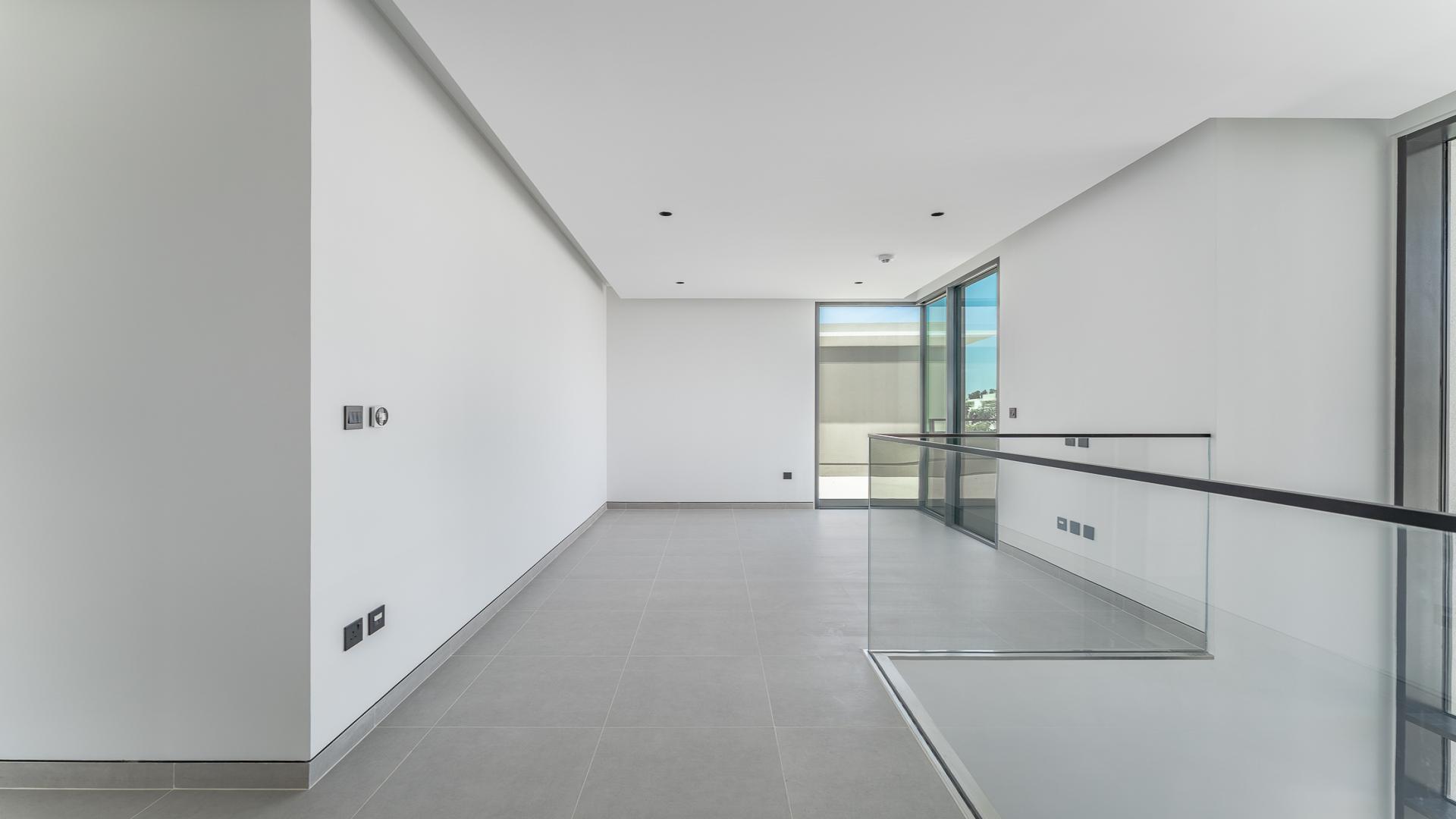 Modern wooden closet and marble countertop in Tilal Al Ghaf 4BR villa for rent