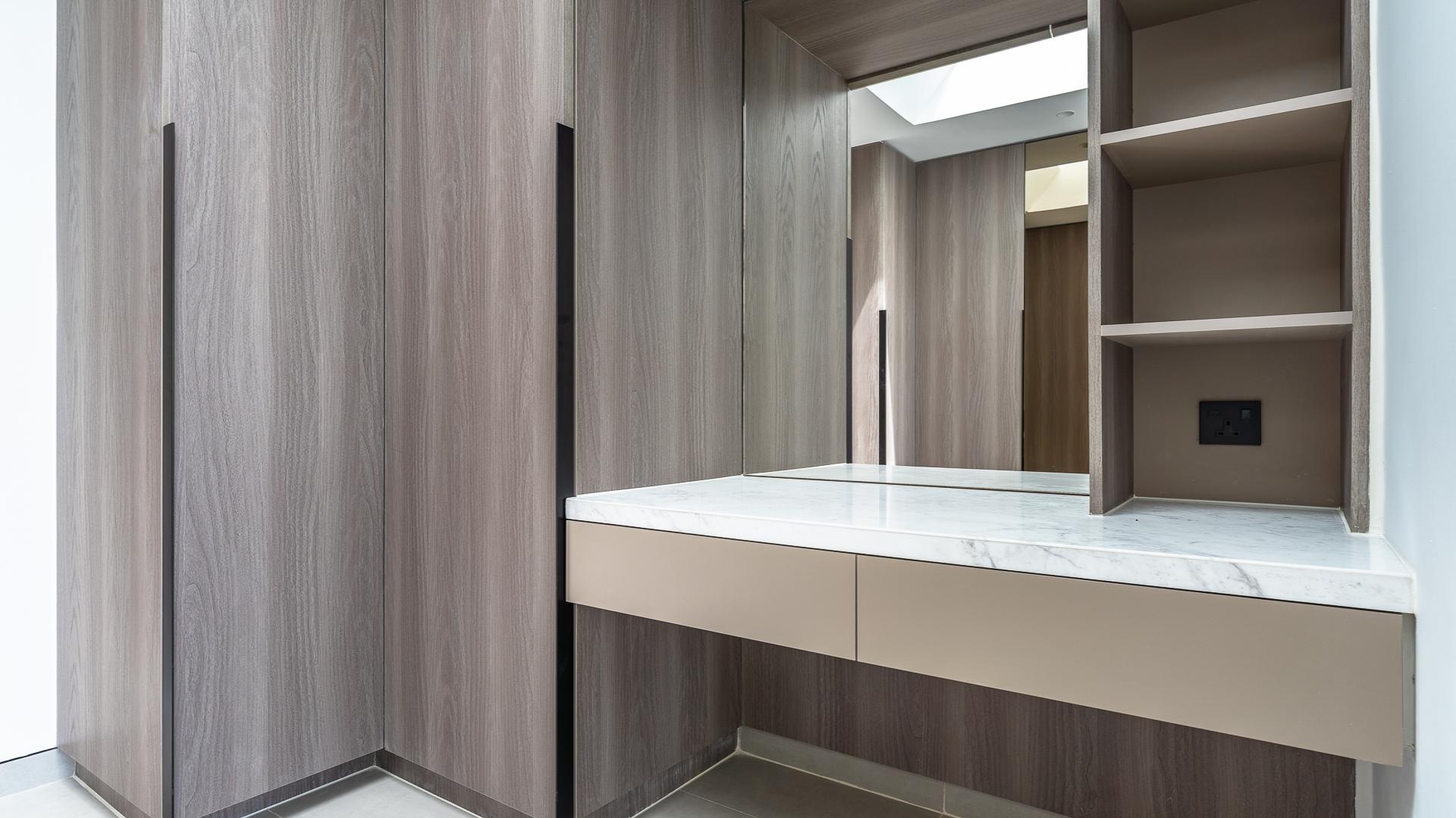 Modern 4BR villa exterior with lawn in Harmony 3, Tilal Al Ghaf, for rent