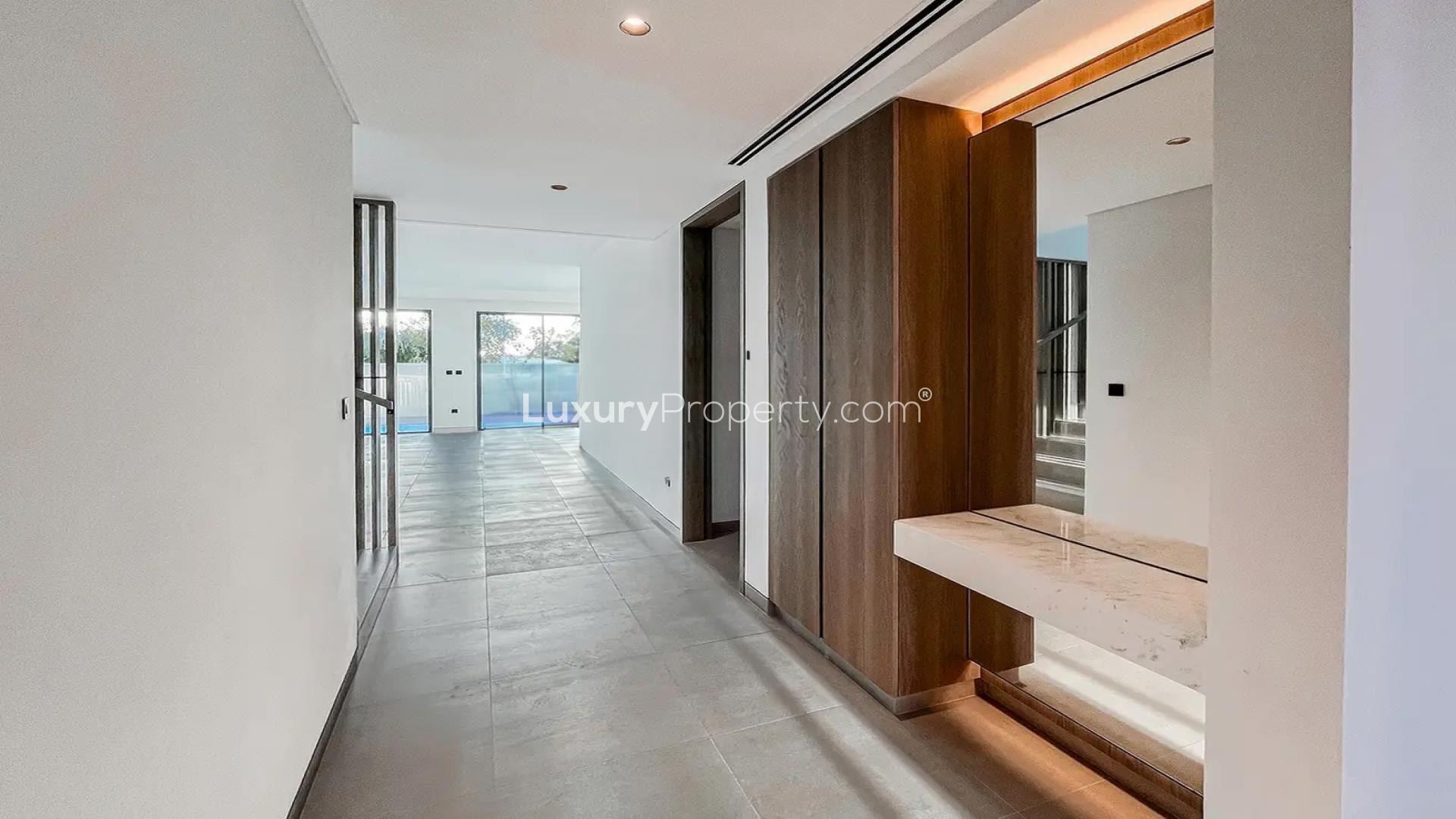 "Spacious hallway in 4-bedroom villa for rent, Harmony 1, Tilal Al Ghaf community.",Empty bedroom with built-in wardrobe in Tilal Al Ghaf villa for rent, Harmony 1