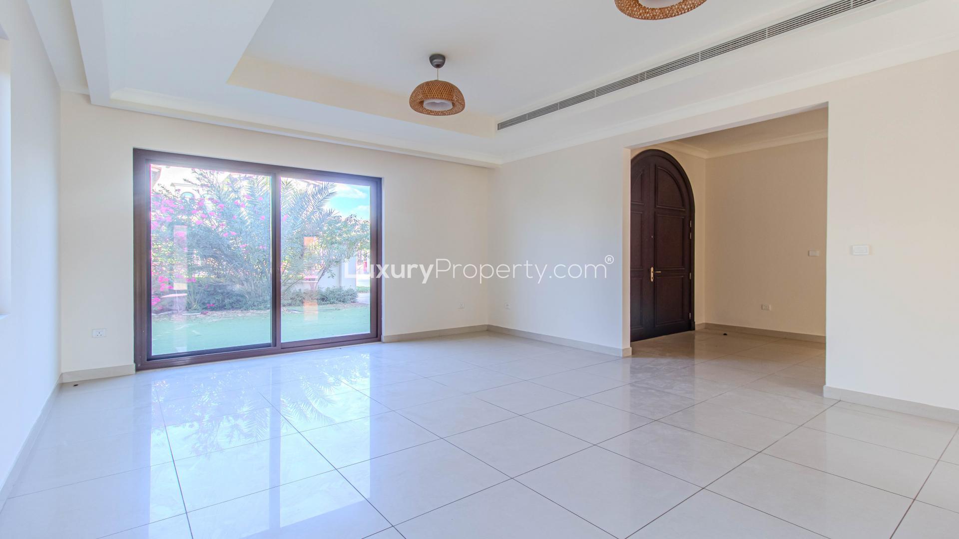 Luxurious 4-bed villa exterior in Rosa, Arabian Ranches 2, spacious garden view