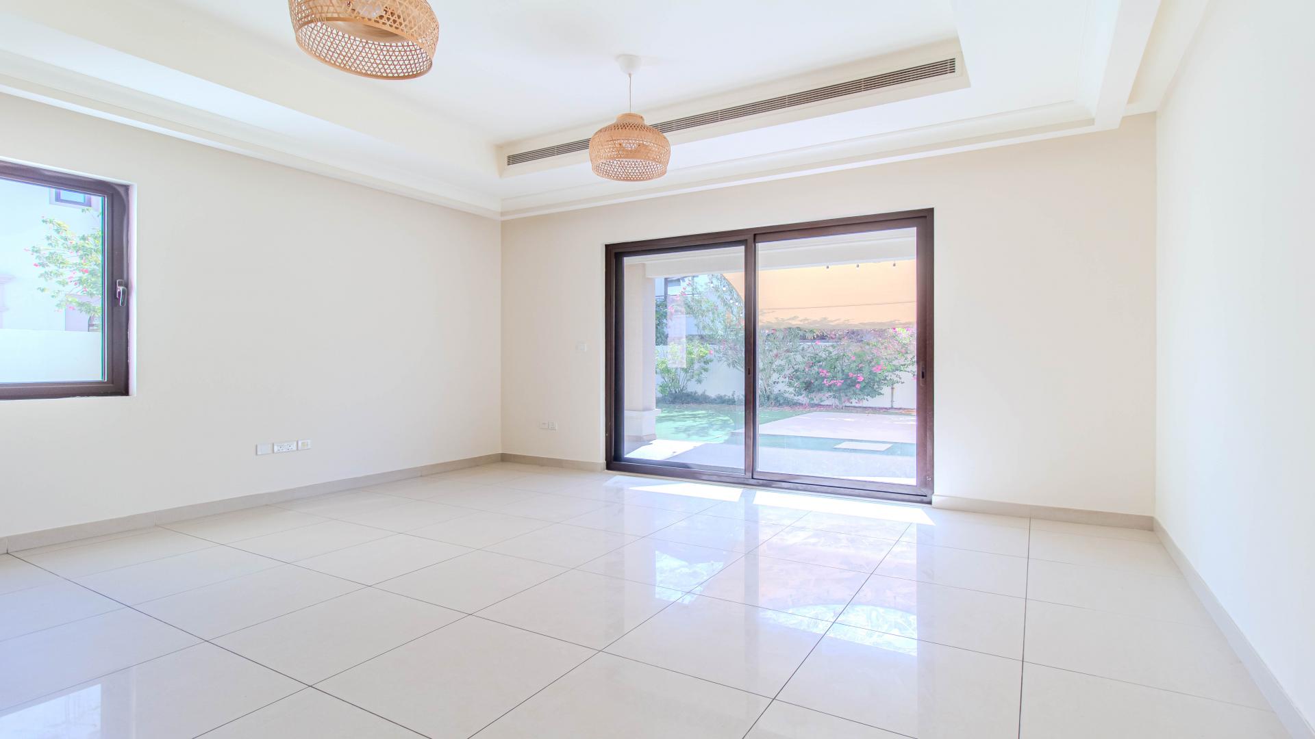 Luxurious 4-bed villa backyard with shade and garden in Rosa, Arabian Ranches 2