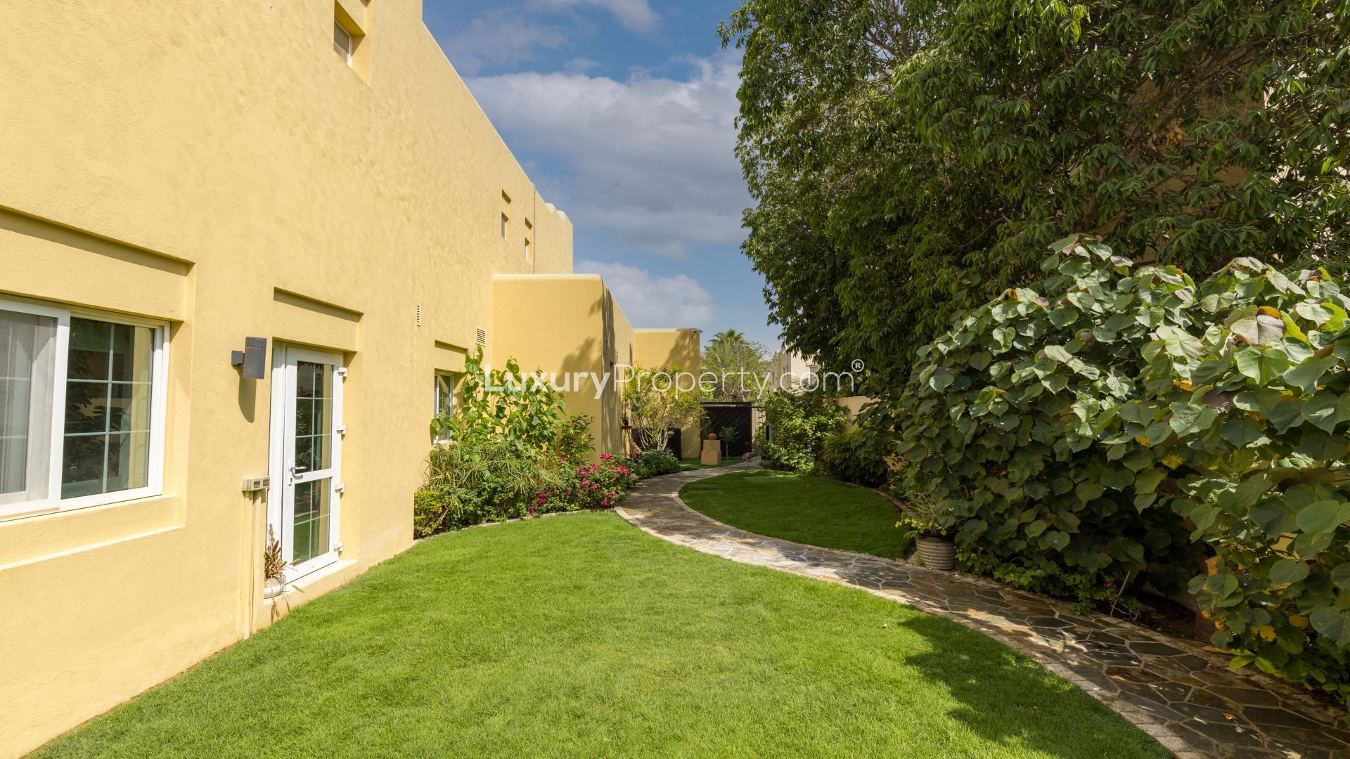 Beautiful furnished villa exterior in Terra Nova, Arabian Ranches, with lush garden and driveway