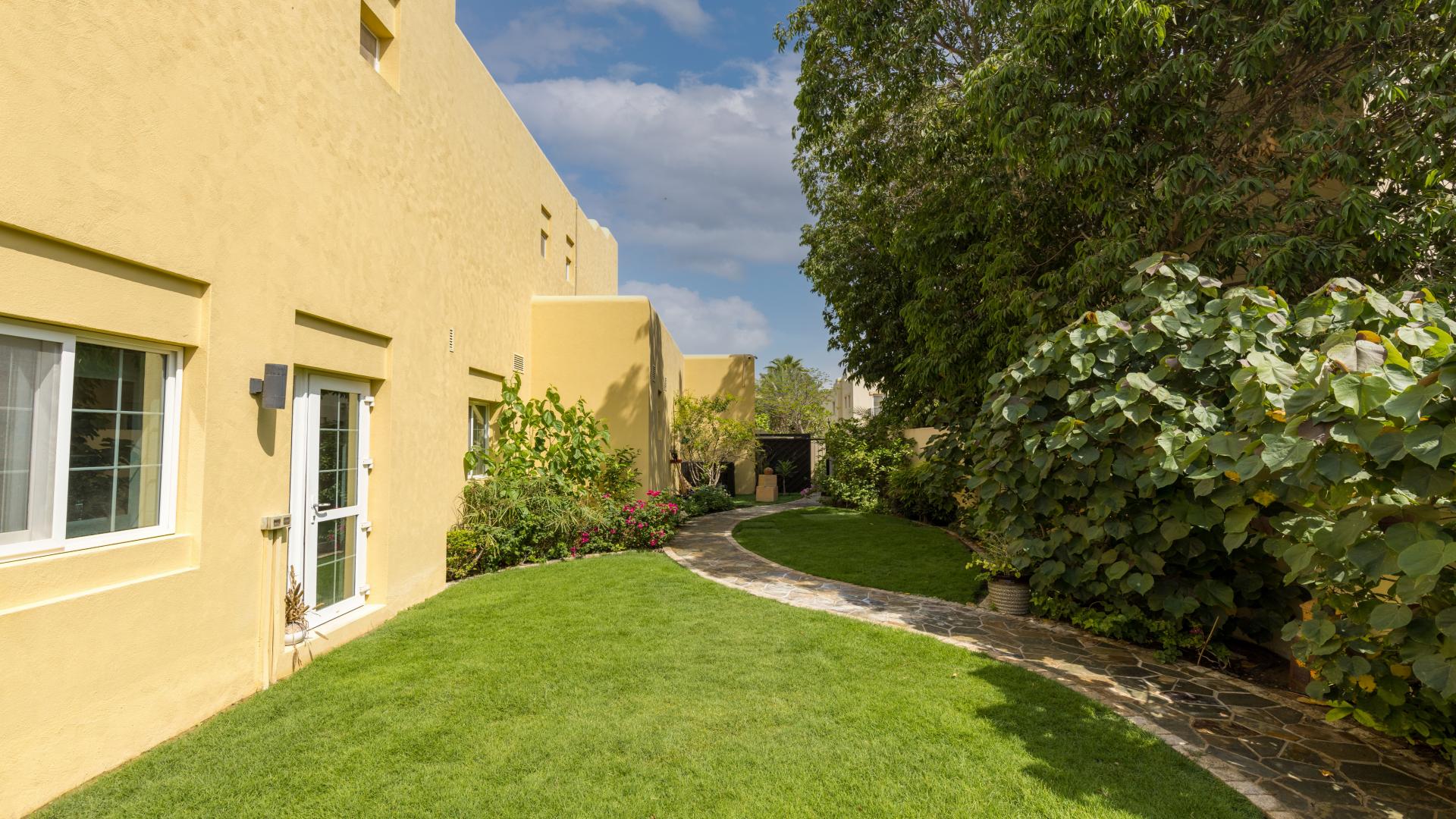 Beautiful furnished villa exterior in Terra Nova, Arabian Ranches, with lush garden and driveway