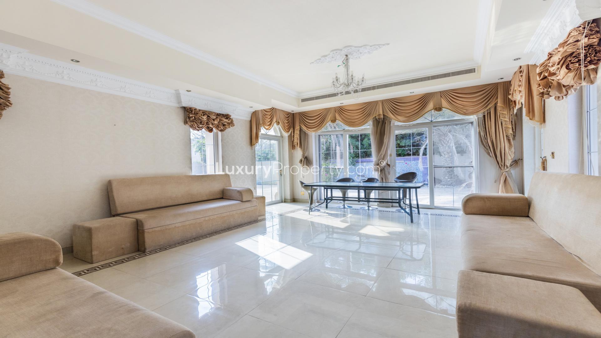 Luxurious 4-bedroom villa exterior with lush landscaping in Alvorada, Arabian Ranches
