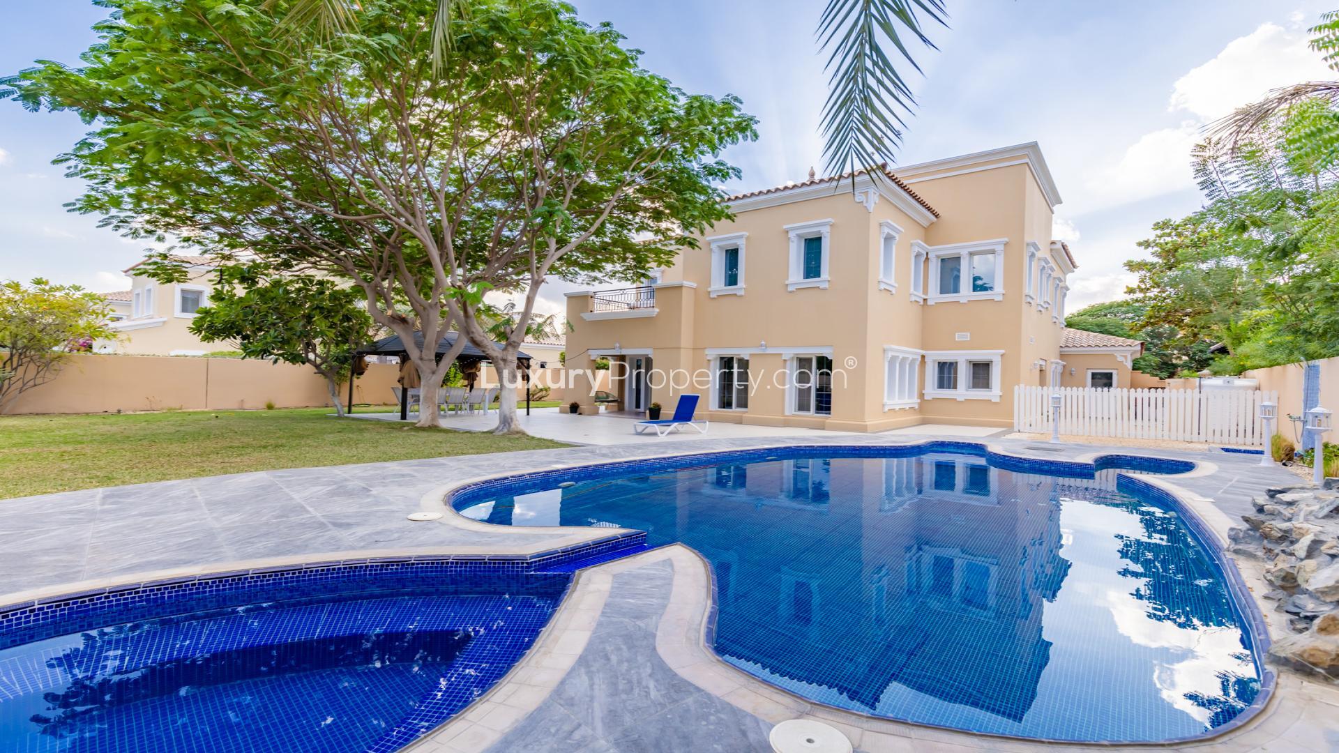 Luxurious living room in 4-bed Alvorada villa, Arabian Ranches, with garden view