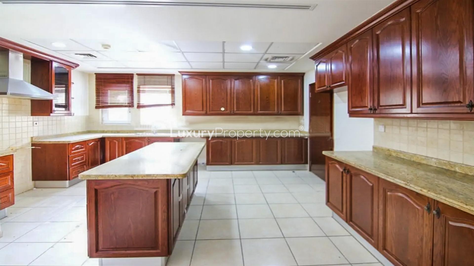 Spacious living room in Alvorada 4 villa, Arabian Ranches, with large windows and garden view