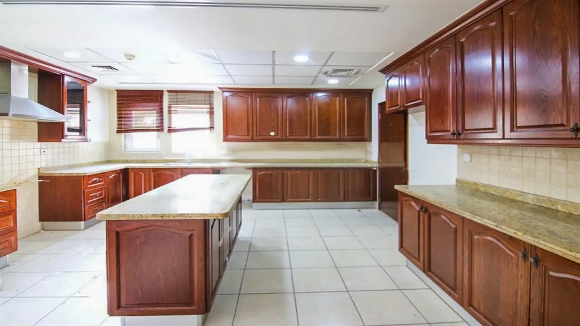 Spacious living room in Alvorada 4 villa, Arabian Ranches, with large windows and garden view