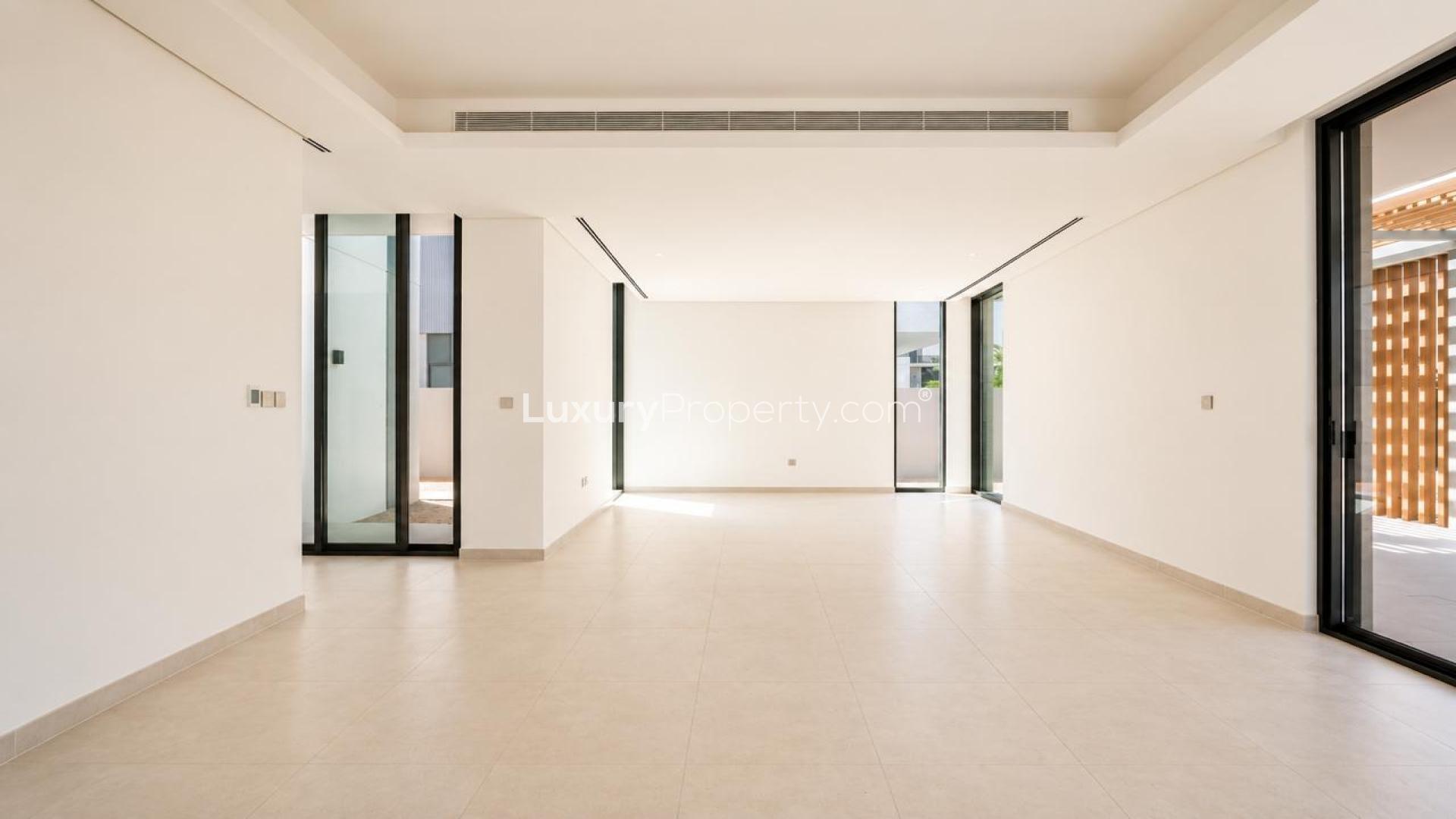 Spacious living area in Elie Saab villa, Arabian Ranches 3, with large windows and natural light