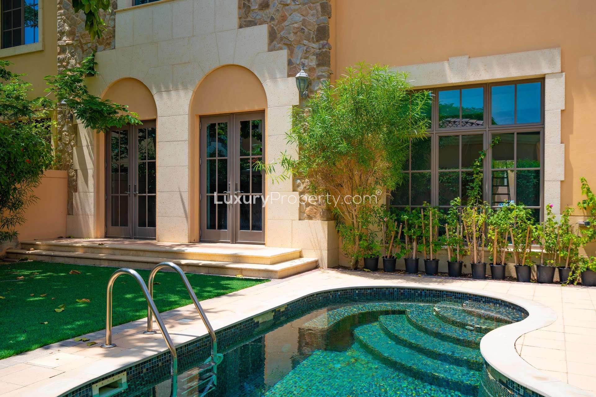"Elegant villa with private pool in Whispering Pines, Jumeirah Golf Estates, Dubai for rent.",Spacious interior of 4-bedroom villa in Whispering Pines, Dubai, with elegant tile flooring