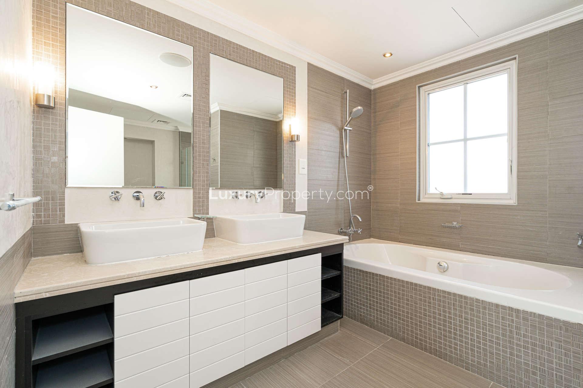 Private villa garden with small pool and shaded patio in Jumeirah Golf Estates