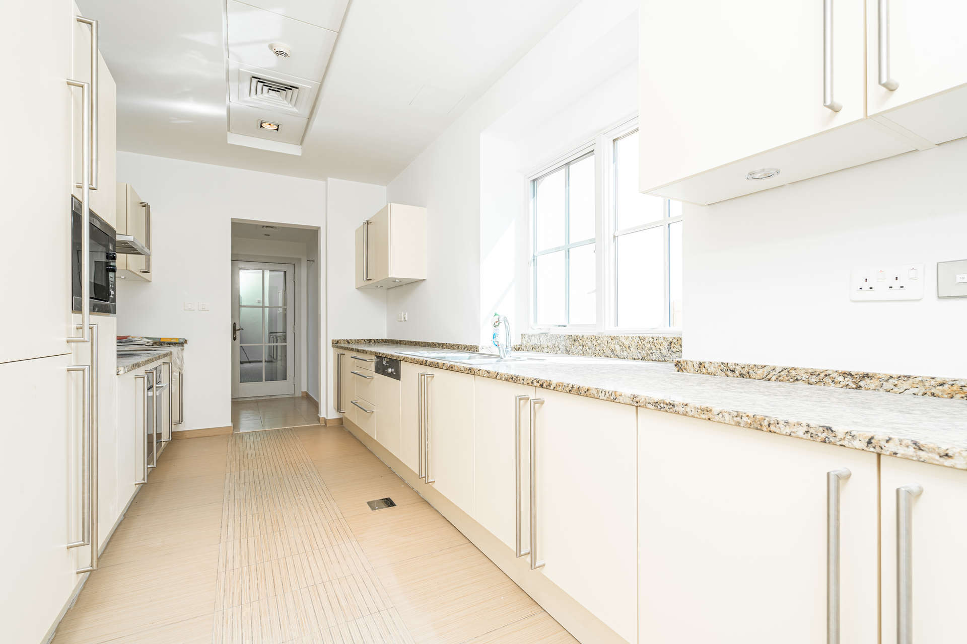 Modern bathroom with glass shower and bathtub in Jumeirah Golf Estates villa for rent