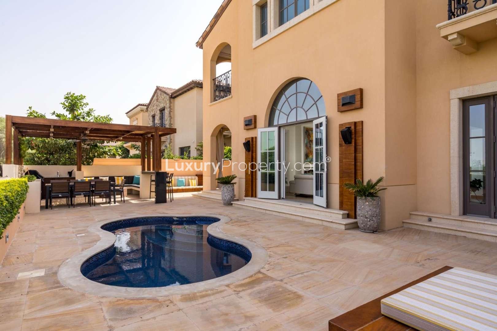 Outdoor patio and pool area at Firestone Villa, Whispering Pines, Jumeirah Golf Estates