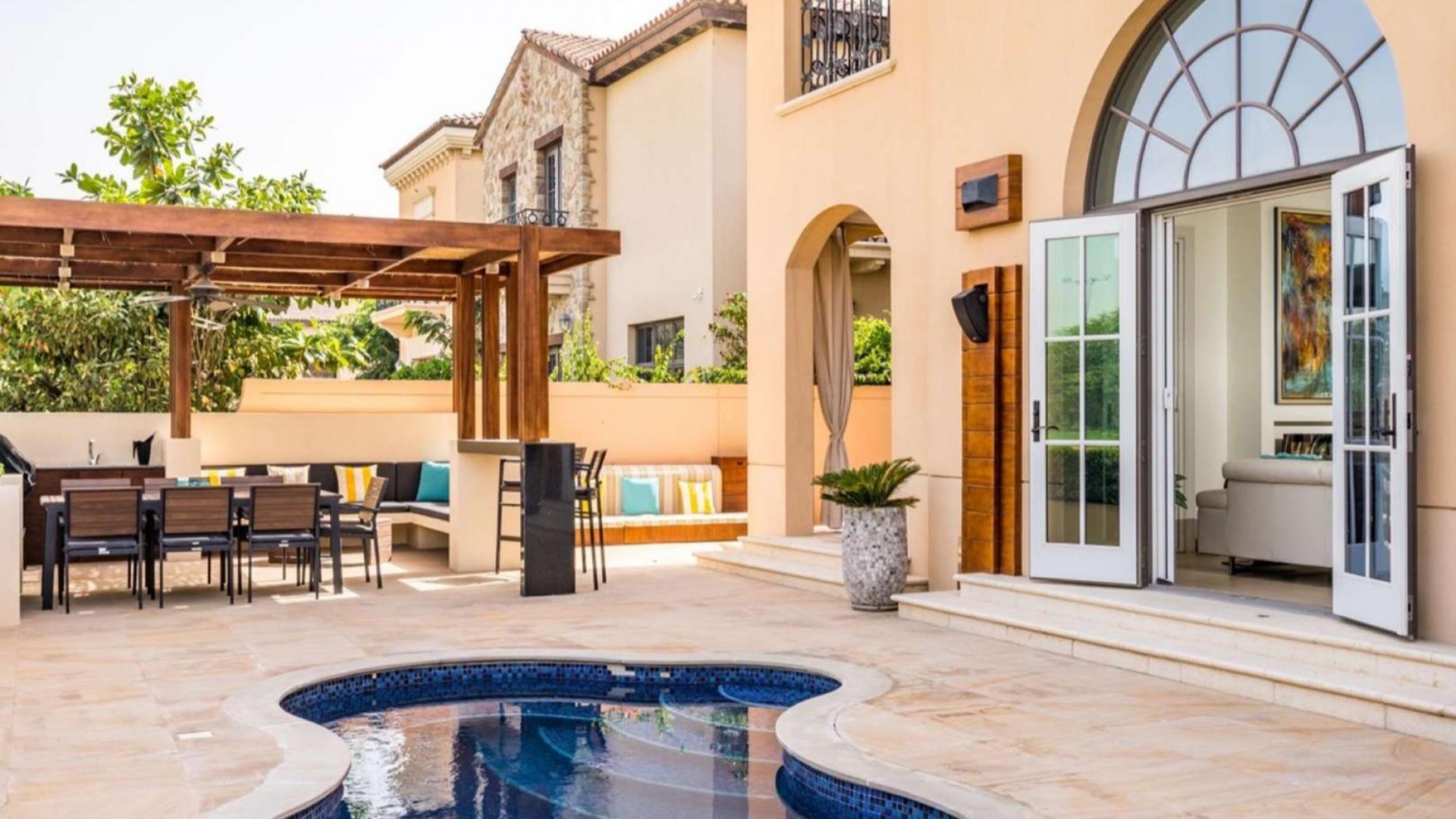 Bright living room in Firestone Villa, Whispering Pines, featuring large windows and modern decor