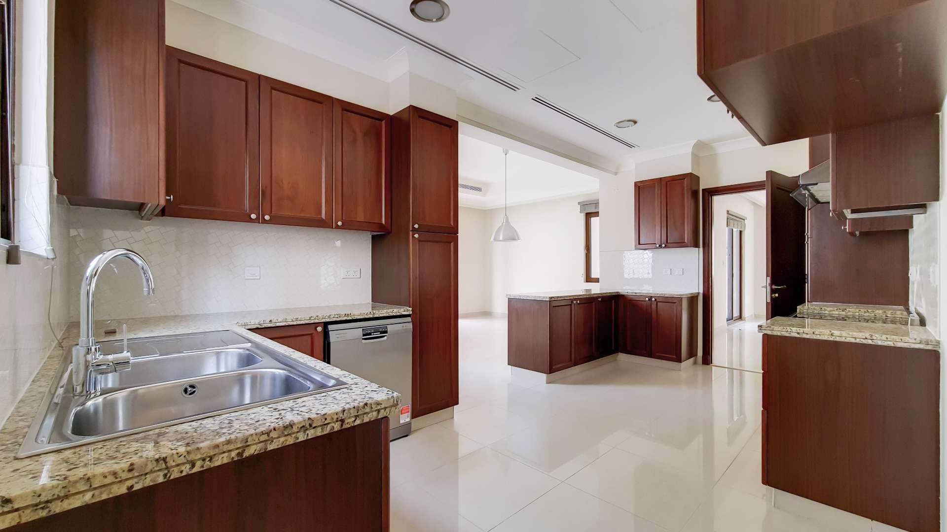 Empty living room in Yasmin villa, Arabian Ranches 2, with modern lighting and large windows