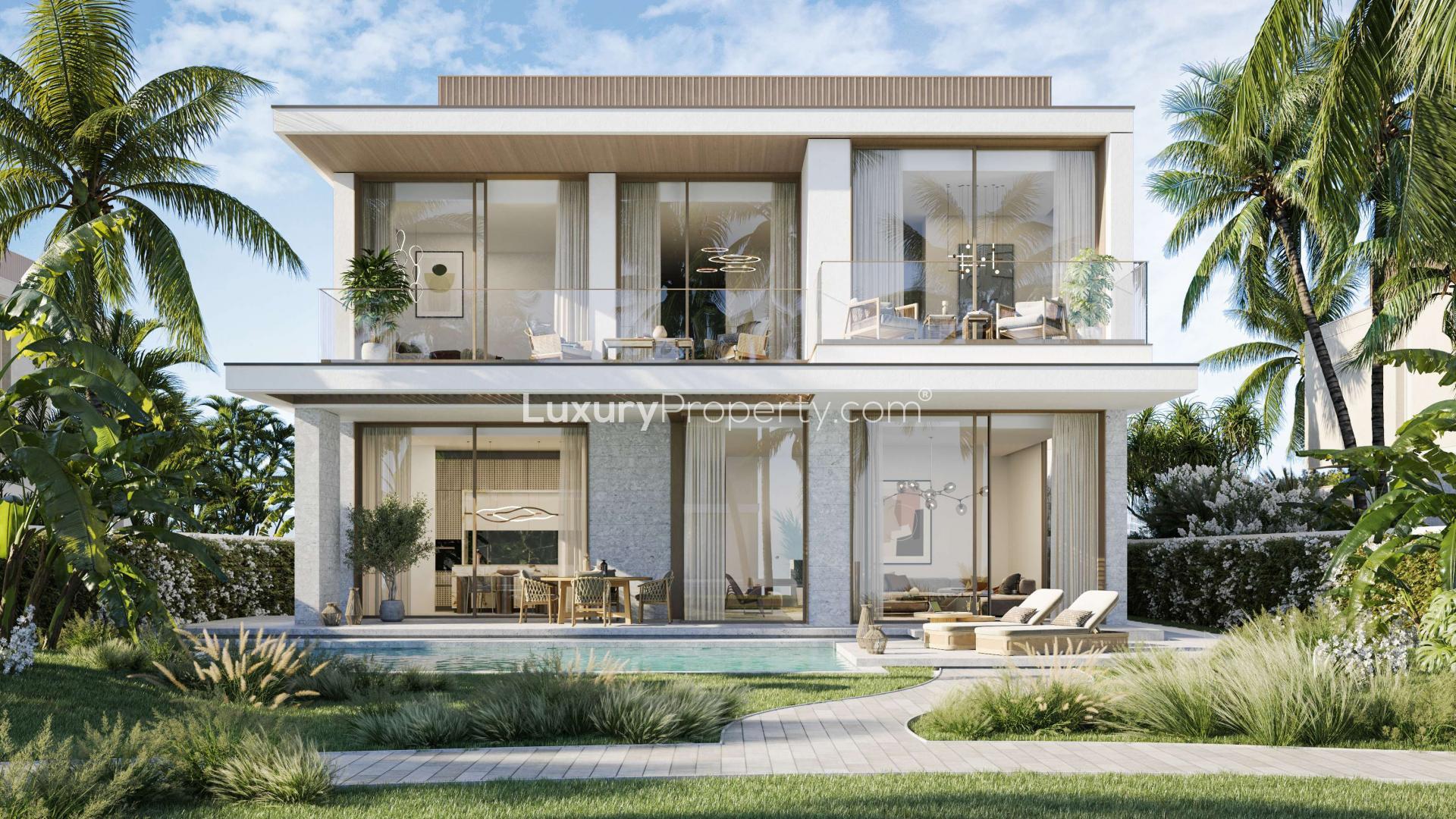 Modern 4-bedroom villa exterior with lush garden in Dubai Islands, Deira community