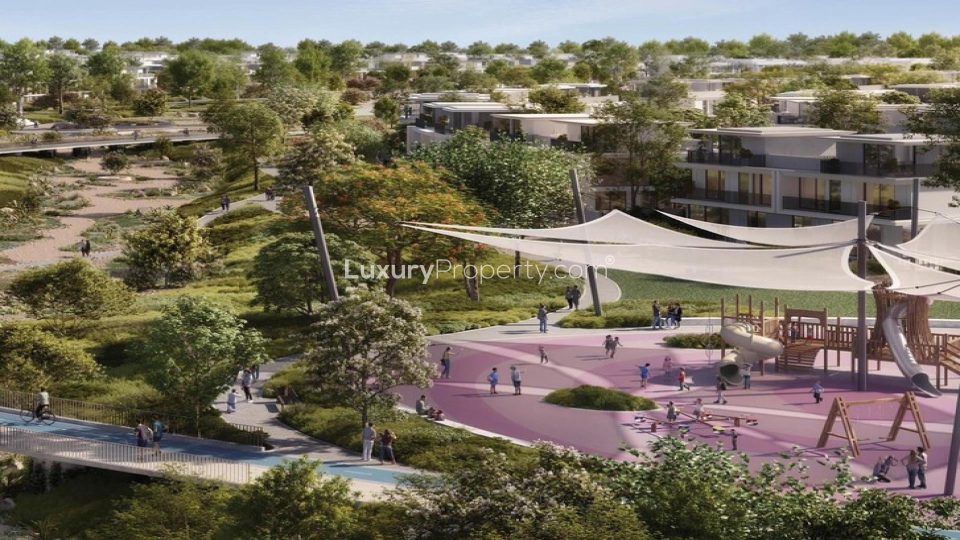 Modern luxury villa exterior in Avena, The Valley Phase 2, surrounded by lush greenery