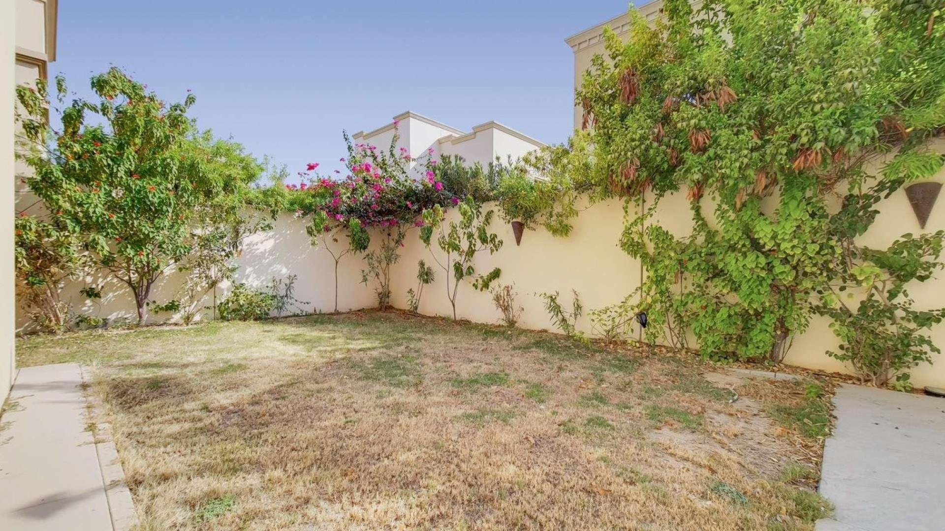 "Spacious garden of premium 4-bedroom villa in Casa, Arabian Ranches 2 for sale.",Kitchen in premium 4-bedroom villa, Casa, Arabian Ranches 2, featuring modern wood cabinetry