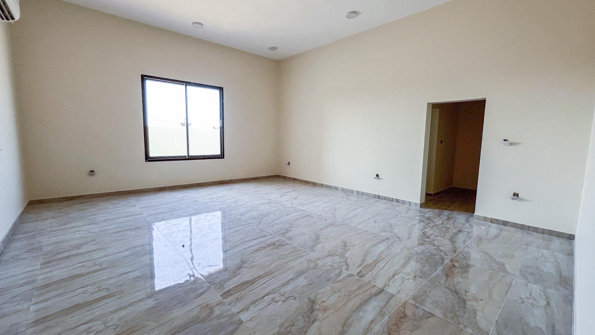 Front view of expansive villa for sale in Al Riffa, RAK with premium amenities