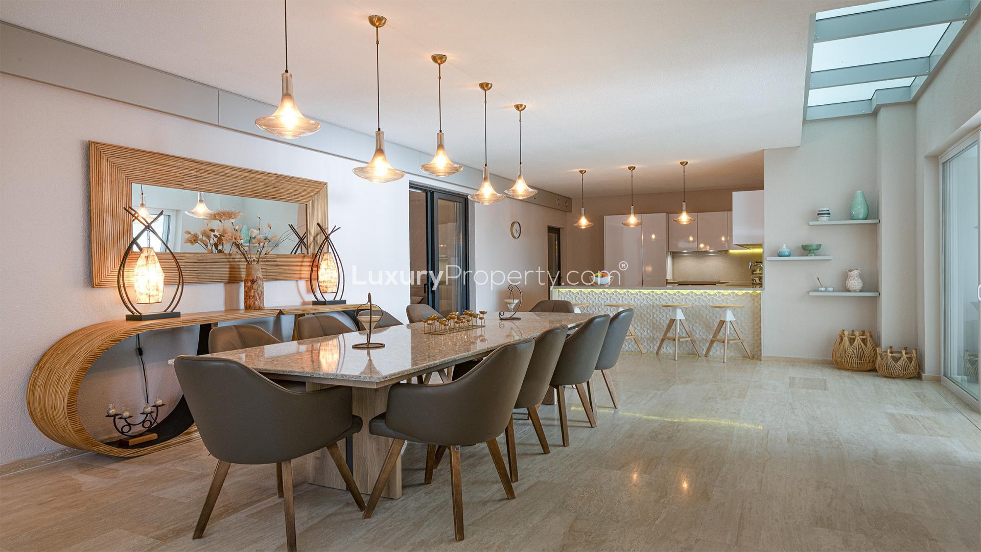 Modern kitchen and dining area in Bodrum villa, Pera Gümüşlük Evleri, with elegant lighting