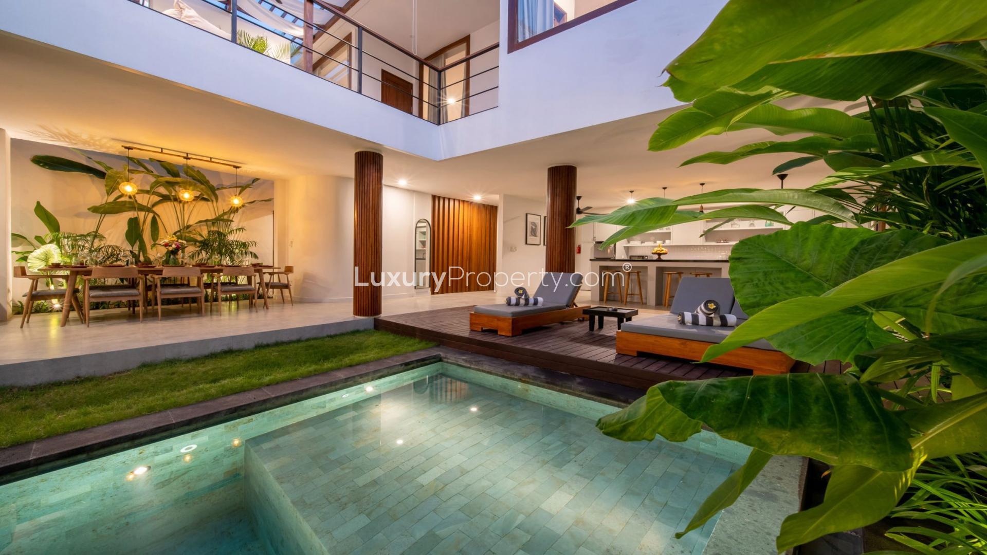 Luxury Berawa villa with pool, modern open-plan living area in Tibubeneng, Bali for sale