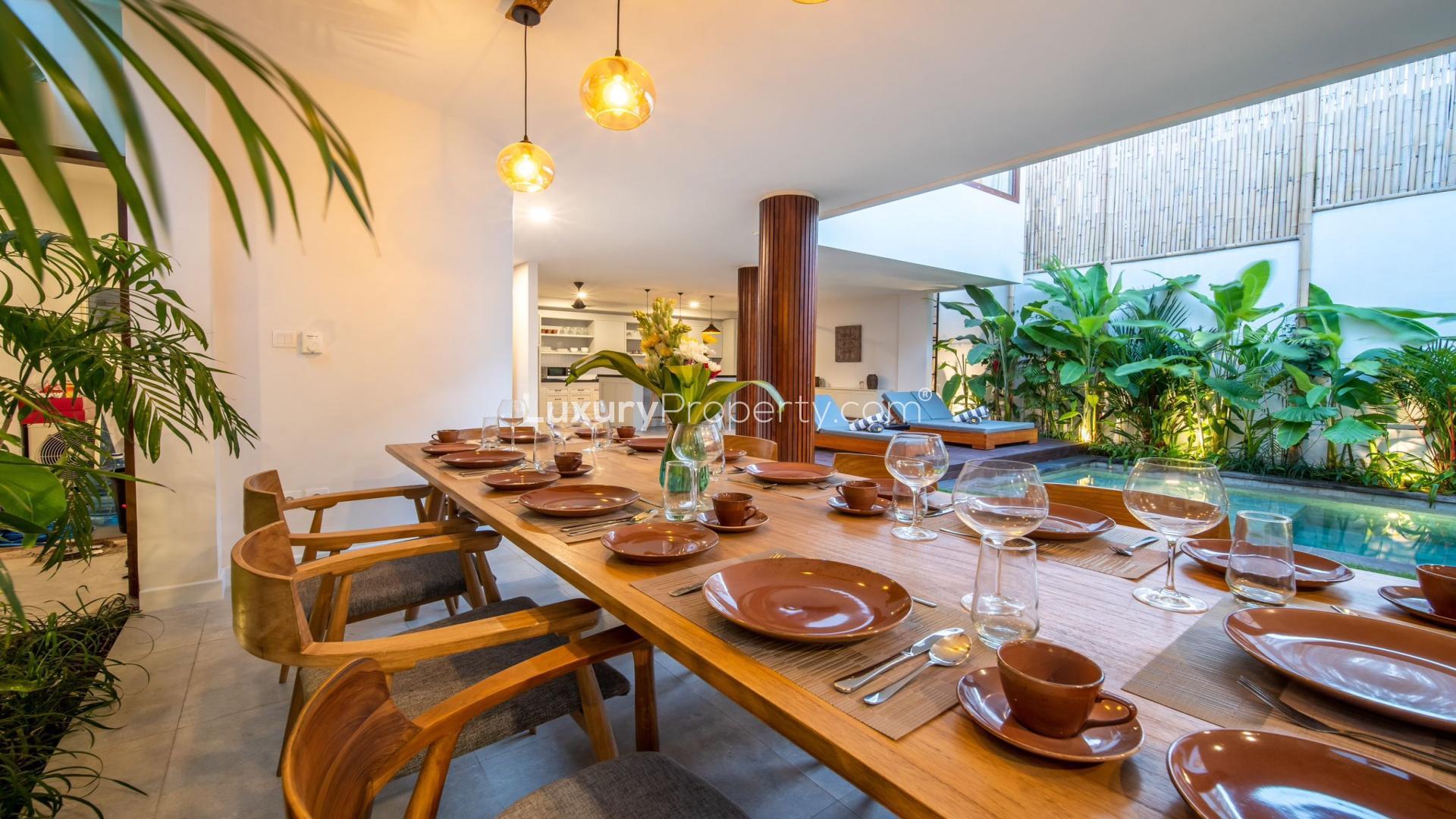 Luxury villa in Berawa, Bali with poolside lounge and open-air dining area