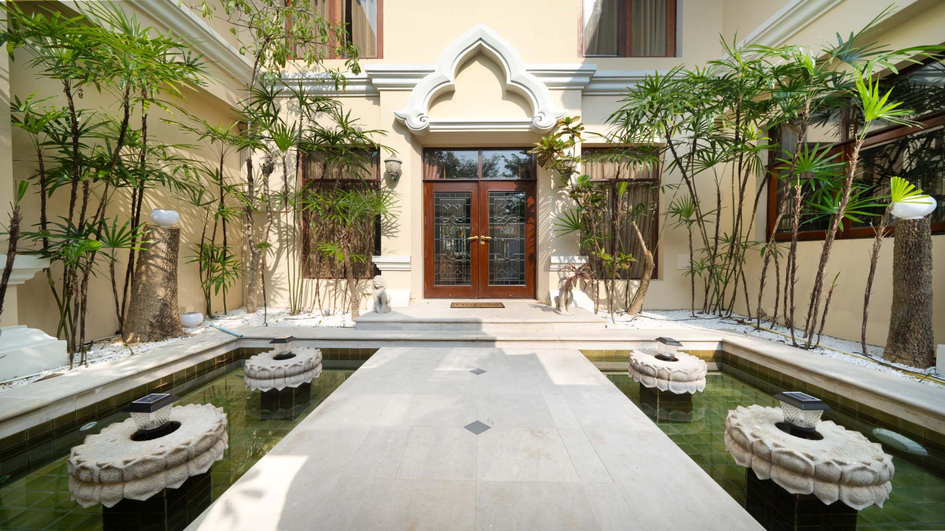 Front entrance of luxury villa with water feature in Viewtalay Marina