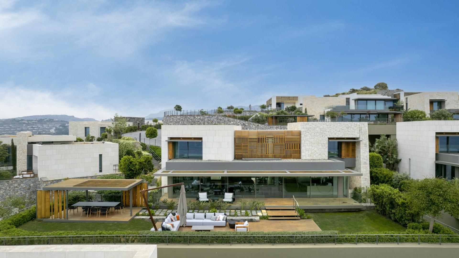 Luxurious living room in Courtyard Villa, Ritz-Carlton Bodrum, featuring modern decor and large windows