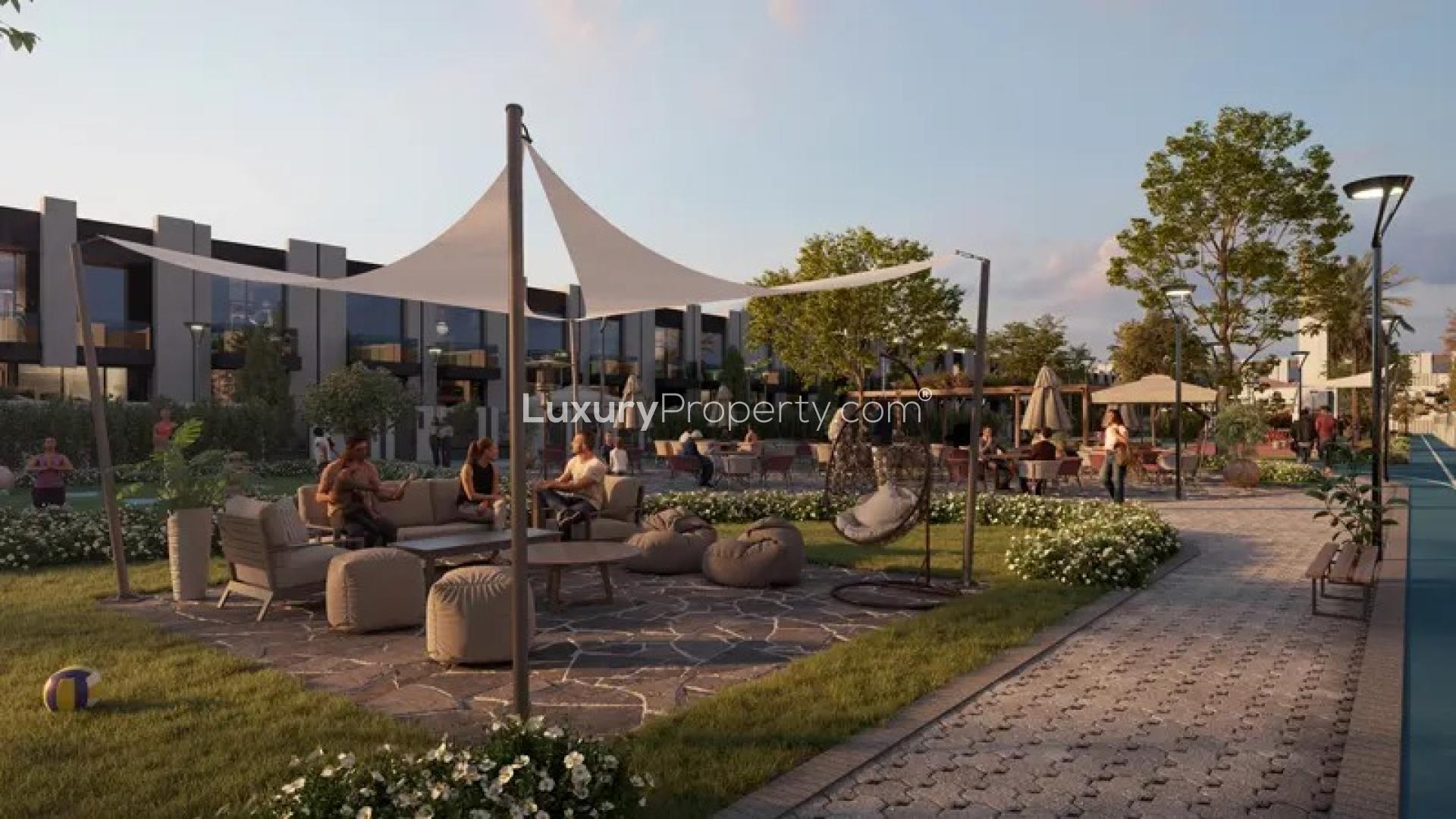 Modern 4BR townhouse exterior in lush Wadi Al Safa, Reportage Village community