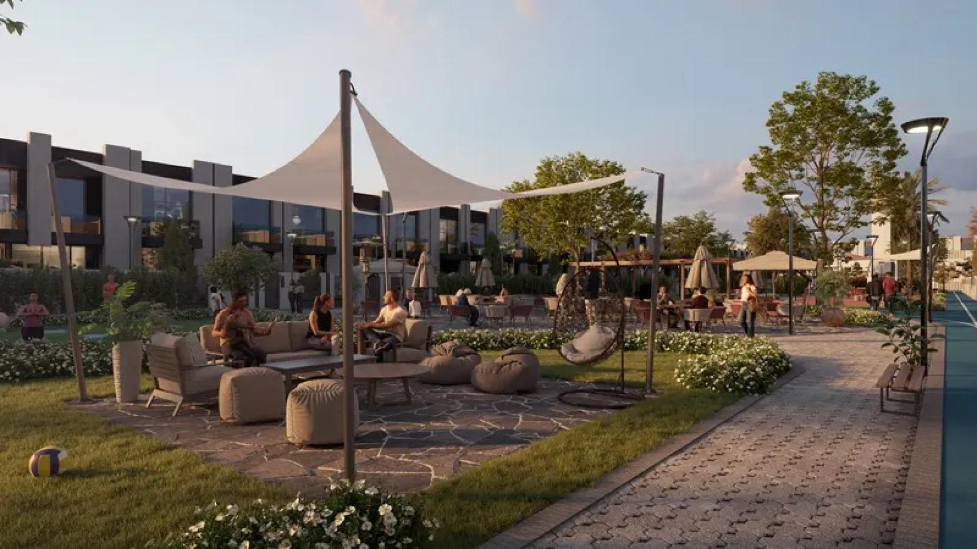 Modern 4BR townhouse exterior in lush Wadi Al Safa, Reportage Village community