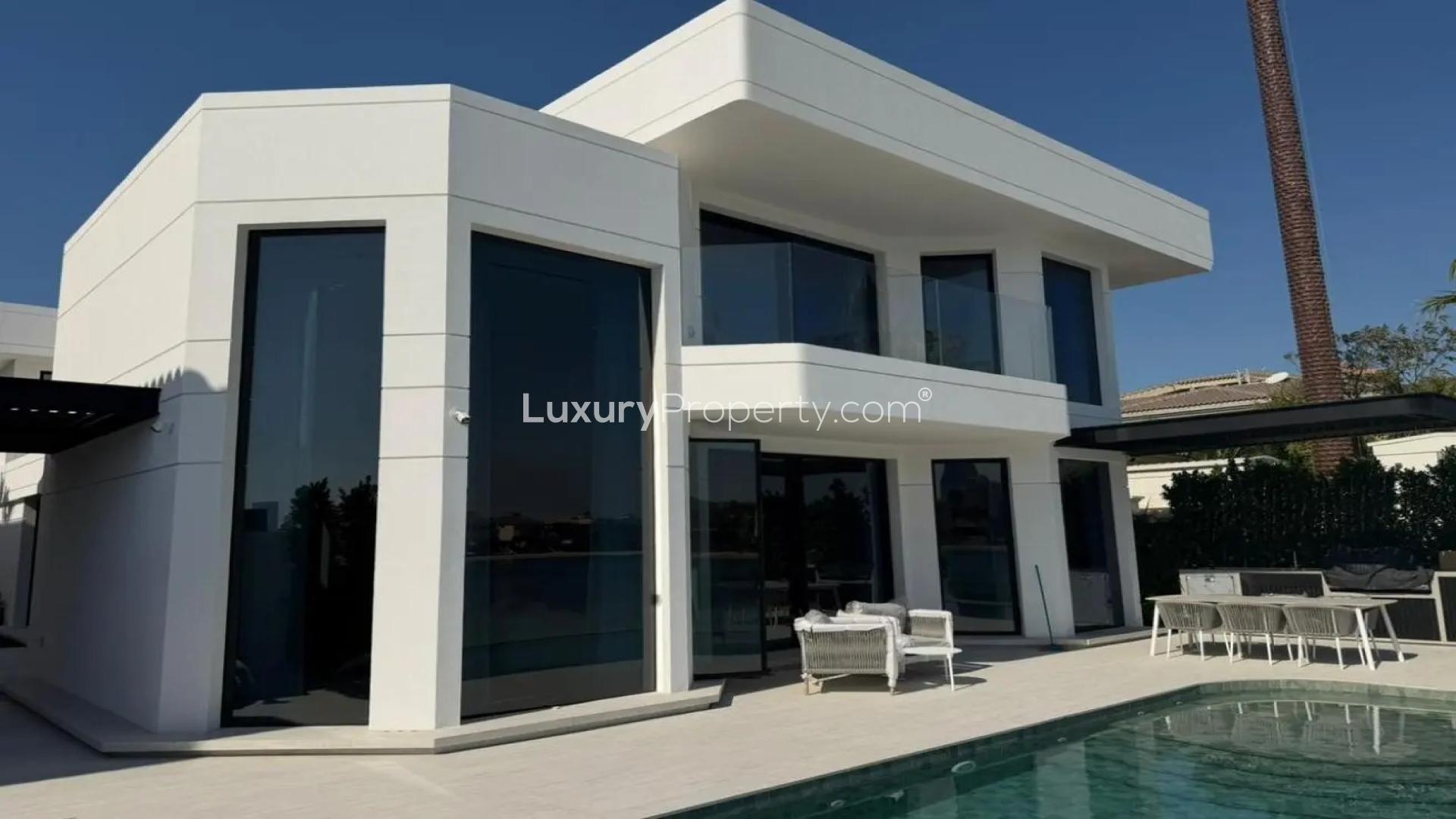 Modern 4-bedroom villa exterior in Palm Jumeirah, Garden Homes Frond E, for sale