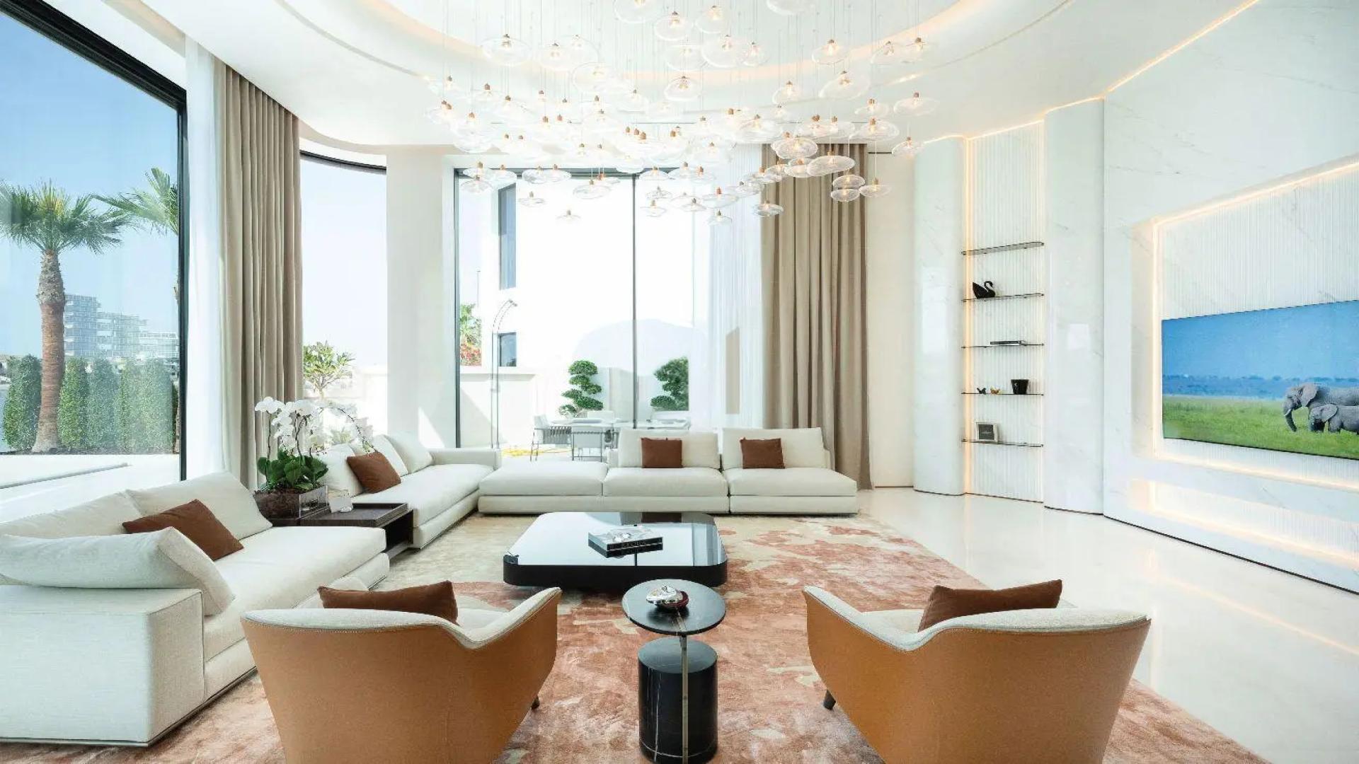 Luxurious Palm Jumeirah villa living room with sea view, elegant decor, and modern furnishings