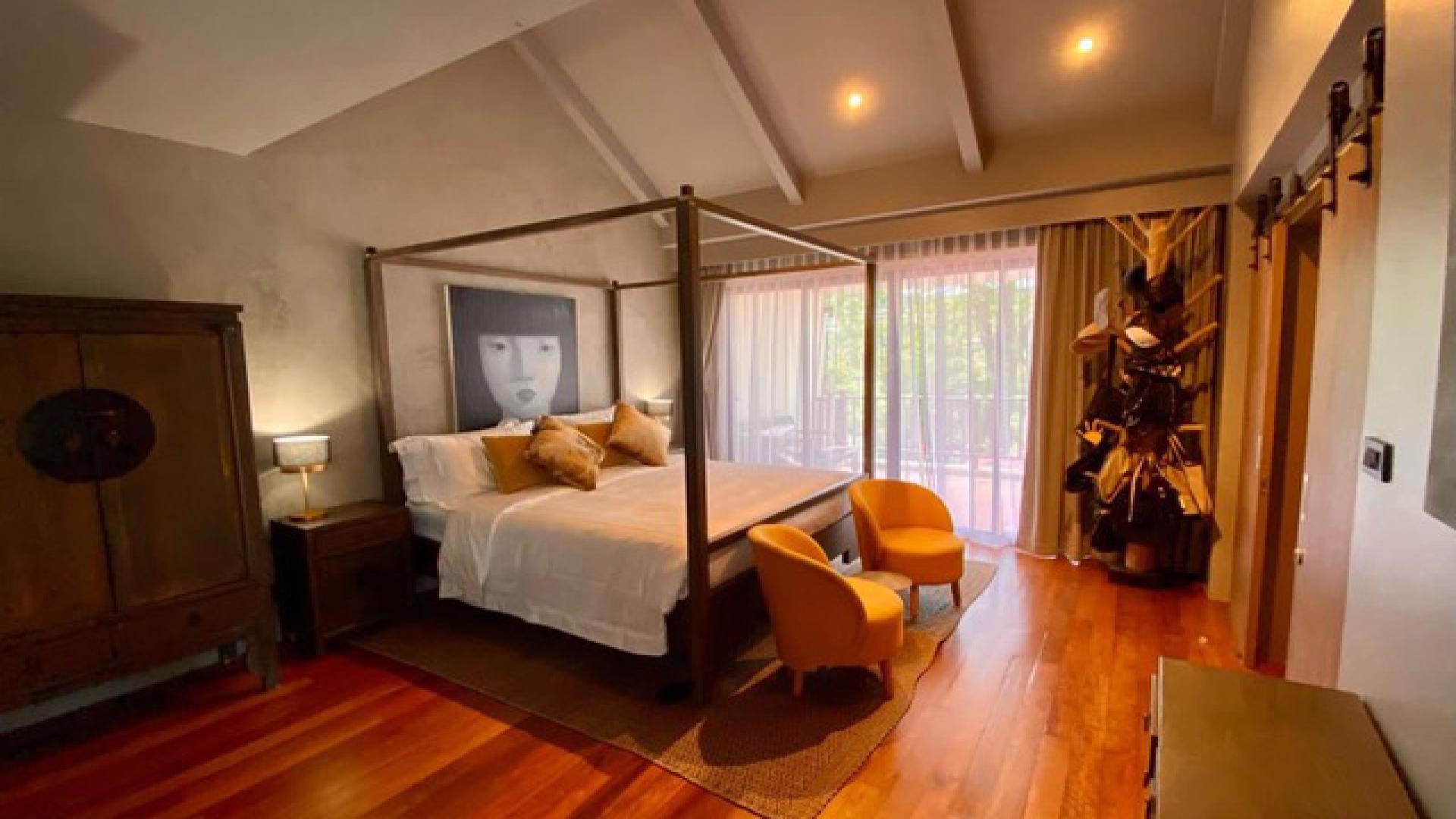 Modern kitchen in luxury Phuket villa, featuring sleek design and spacious island counter