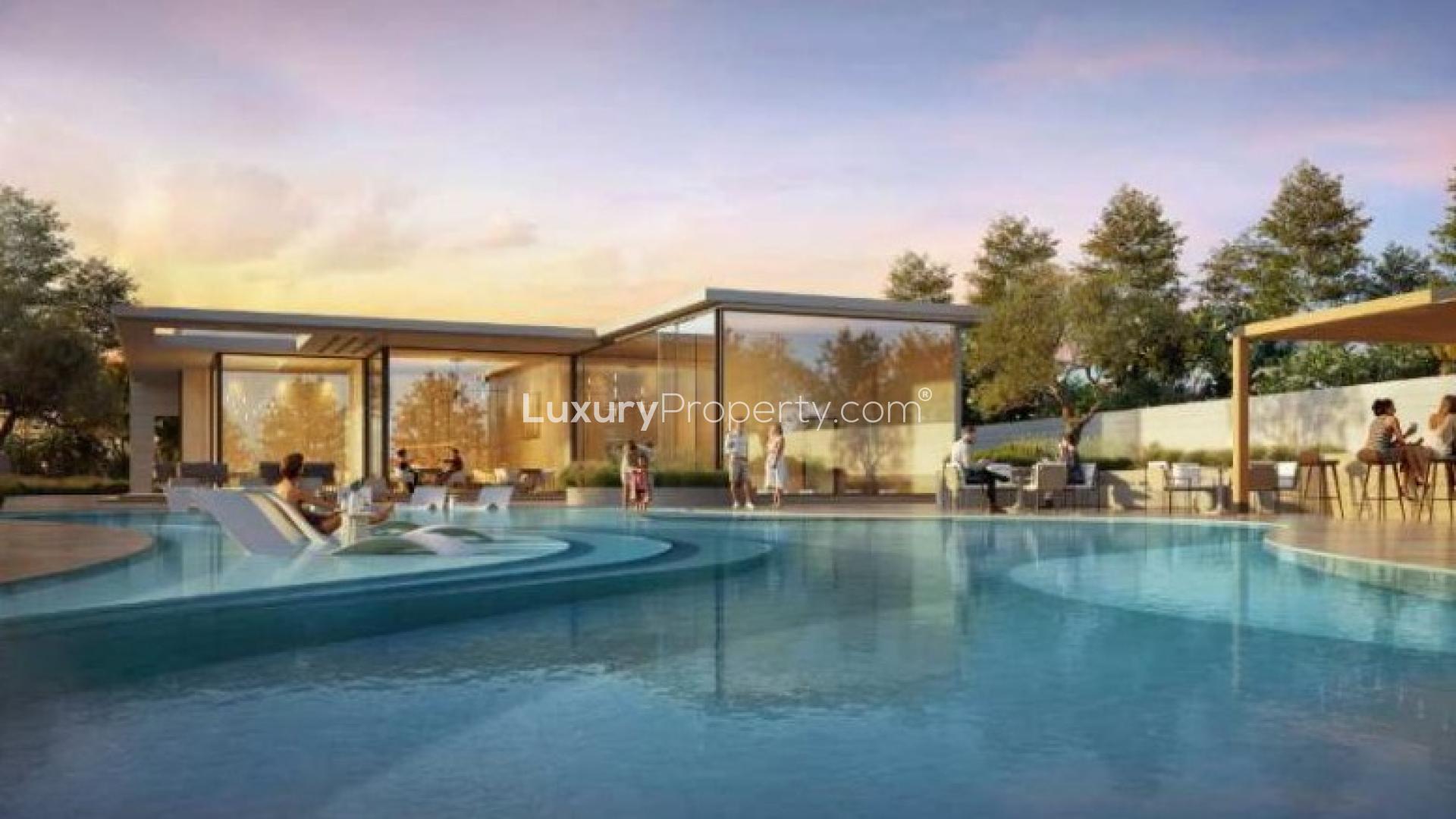 "Elegant living room in 4-bedroom villa at Dar Global Villas, Jumeirah Golf Estates.",Luxurious villa with poolside view in Jumeirah Golf Estates, Dar Global Villas