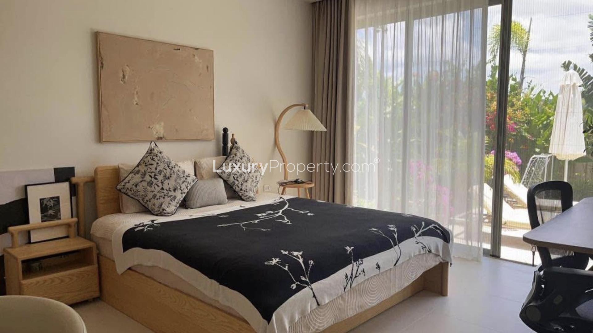 Dining area and modern kitchen in Trichada Breeze villa, Choeng Thale, Phuket