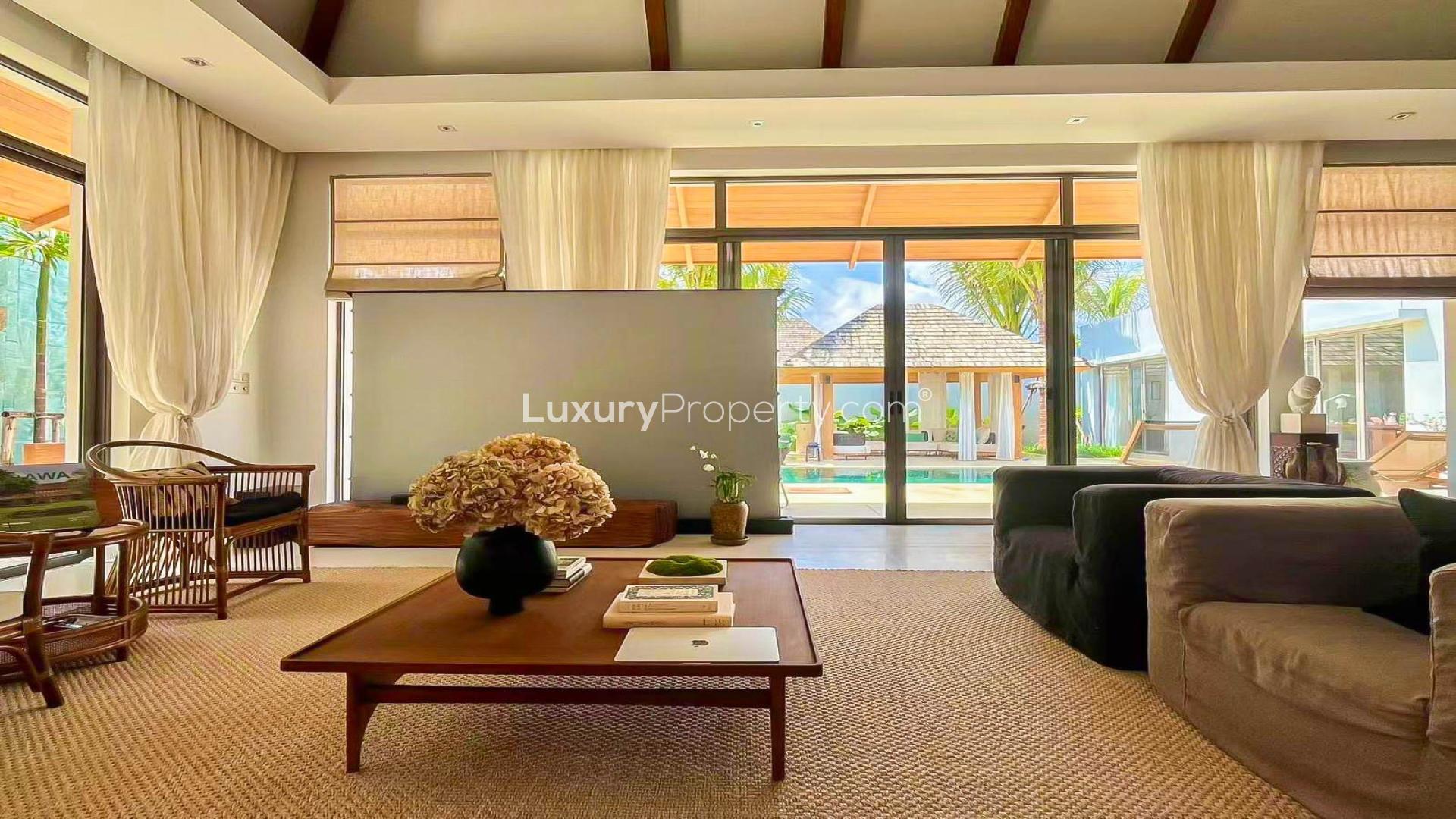Luxurious villa in Thalang District, Thailand with poolside cabana and lush greenery