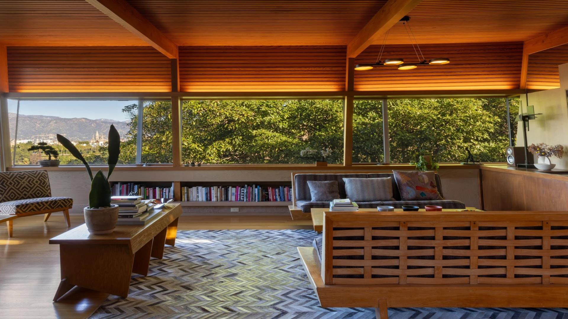 Luxurious dining area with fireplace and city views in Hollywood Hills villa for sale