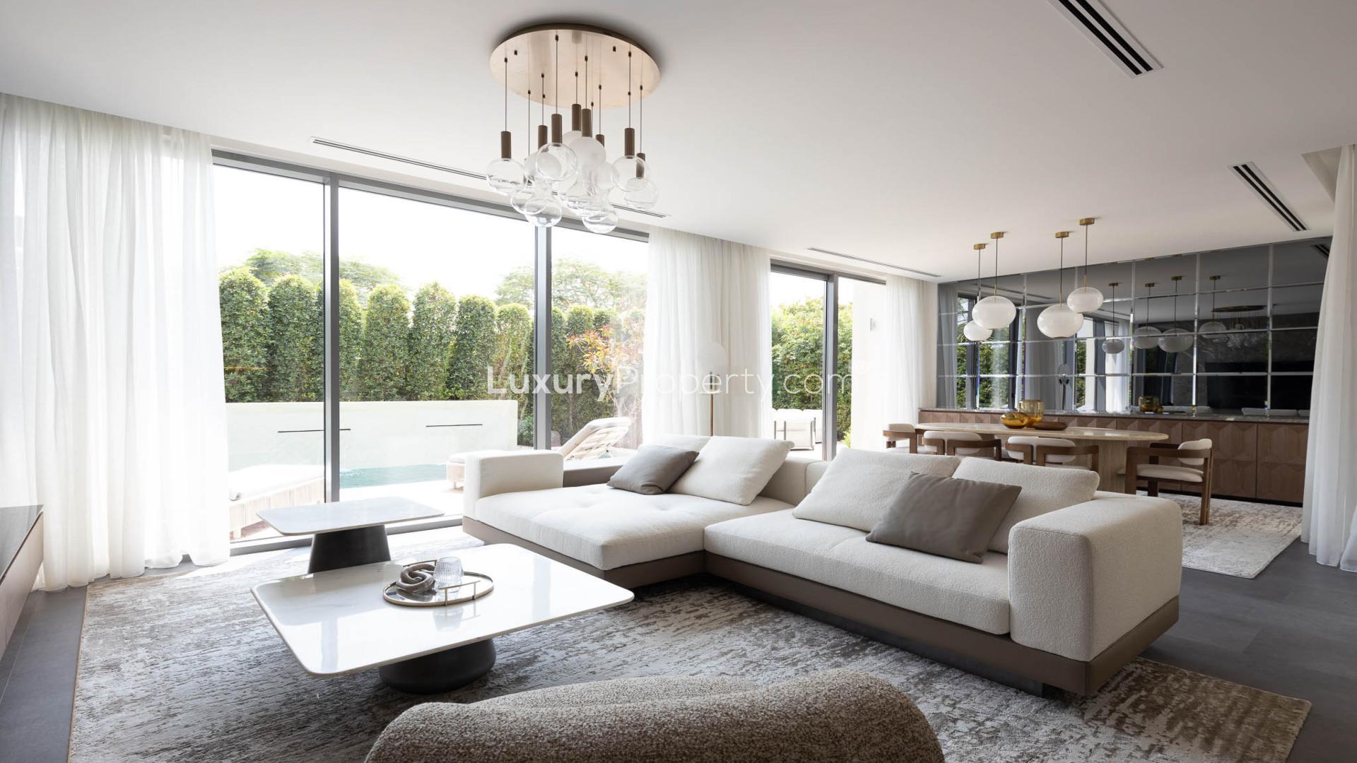 "Modern villa with private pool in Sidra III, Dubai Hills Estate, for sale.",Modern living room in Sidra III villa, Dubai Hills Estate, with elegant decor and natural light