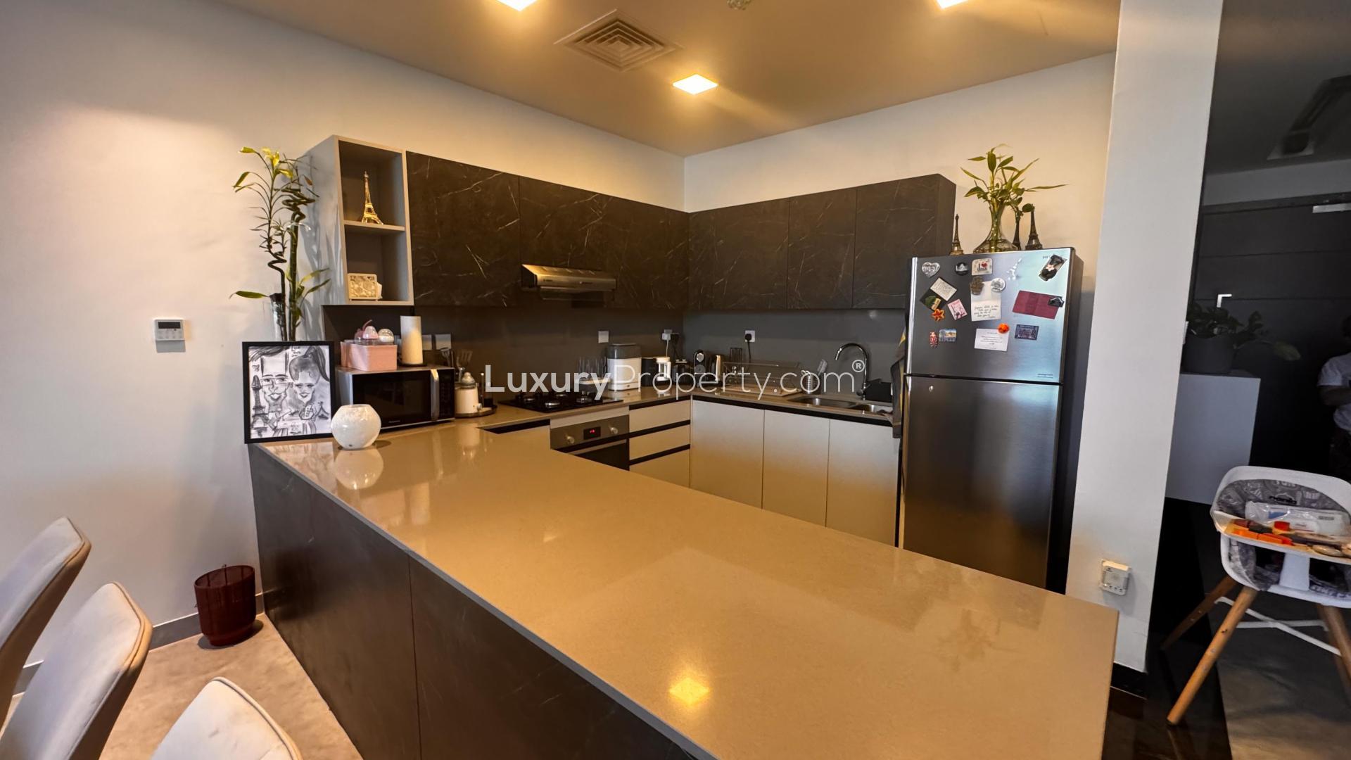 Modern living room in Al Furjan West villa for sale, featuring elegant decor and natural light