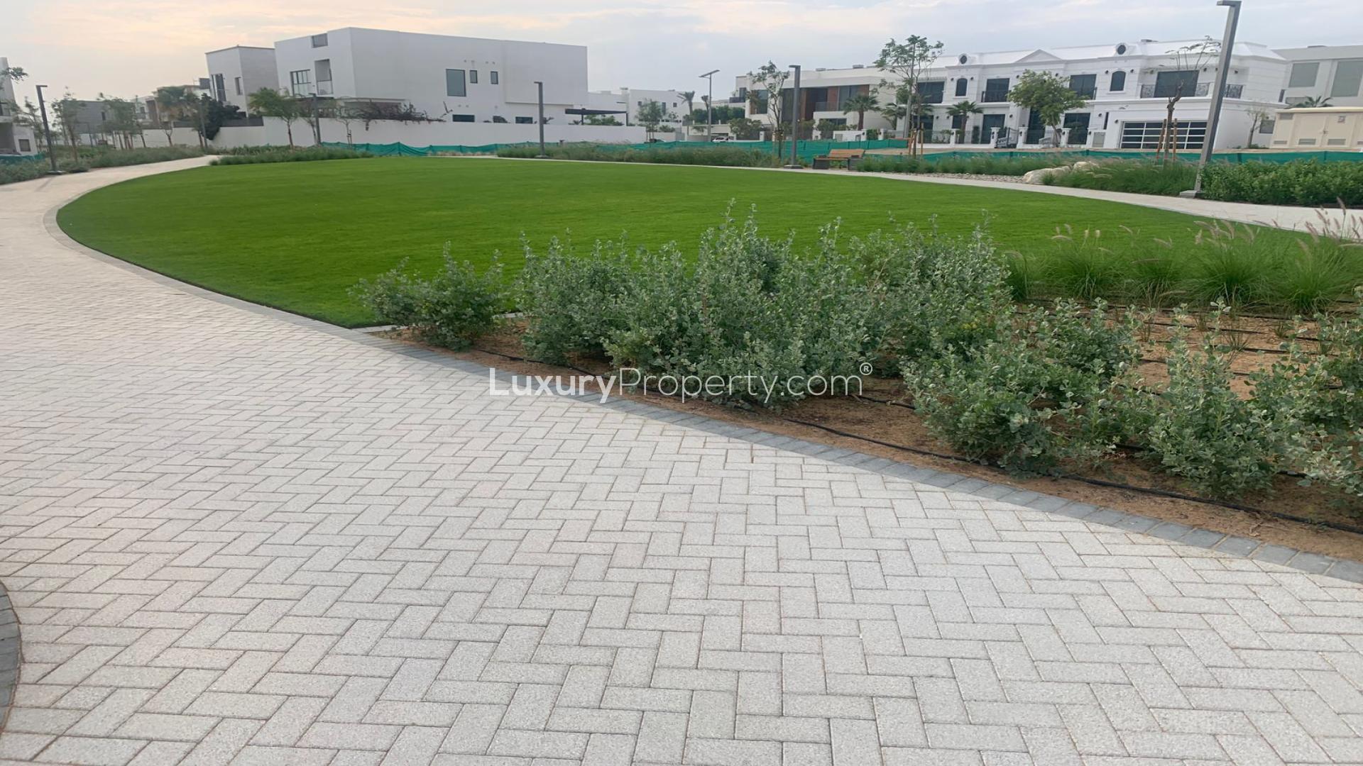 Modern living room in Al Furjan West villa for sale, featuring elegant decor and natural light