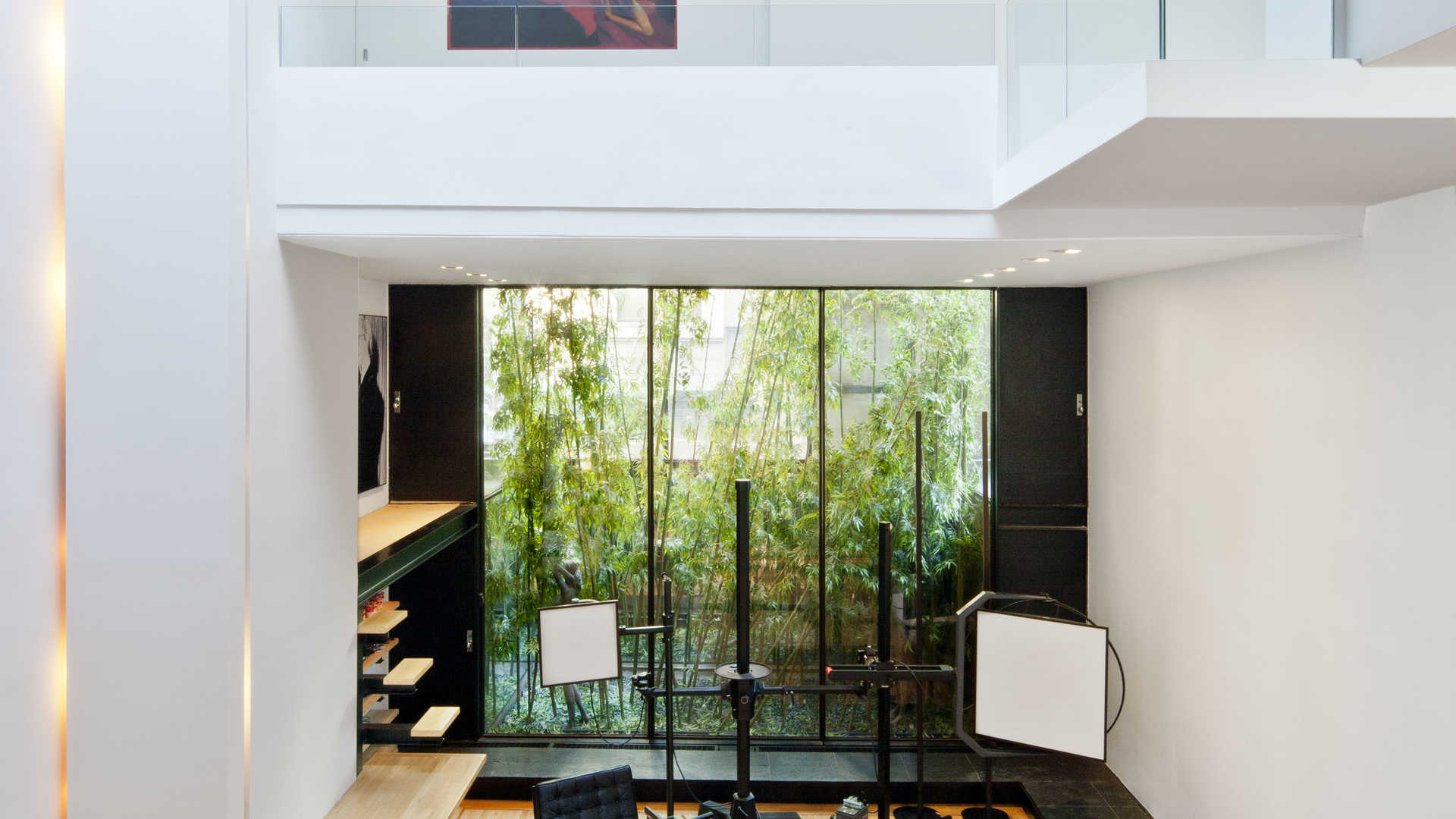 Luxurious living area in four-tier Manhattan townhouse with large windows and modern design