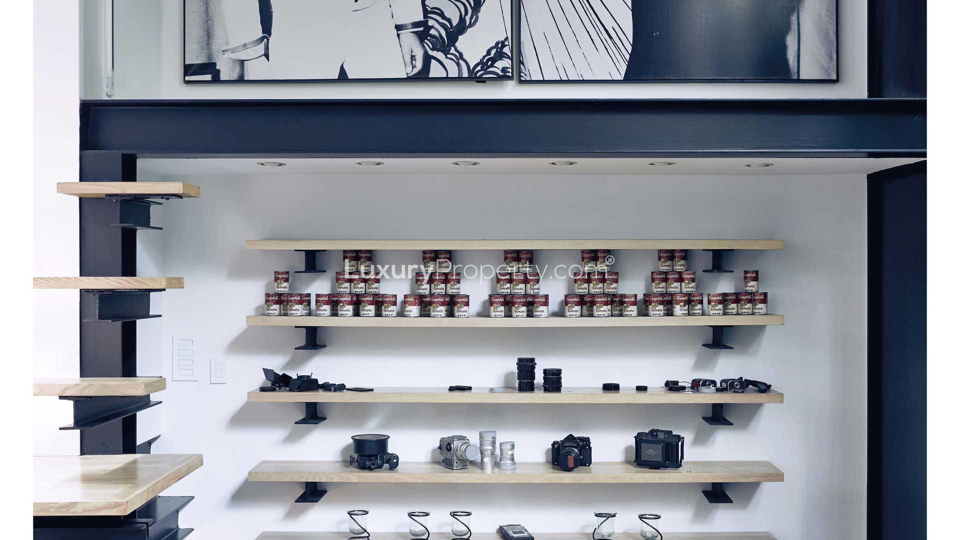 Shelving unit with art, cameras, and cans in Manhattan townhouse, 101 East 63rd Street