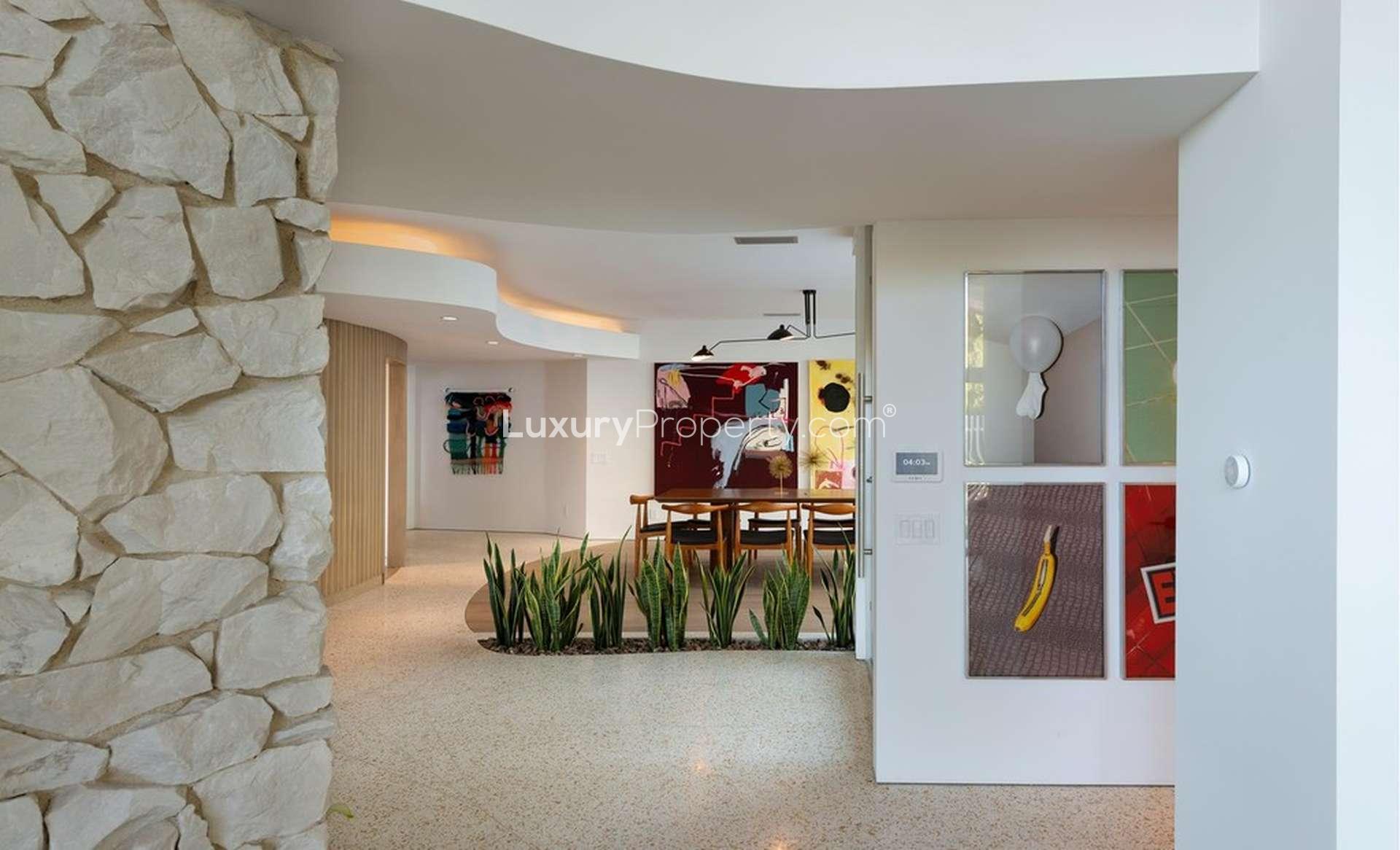 Modern dining area with artistic decor in ocean view villa, Los Angeles