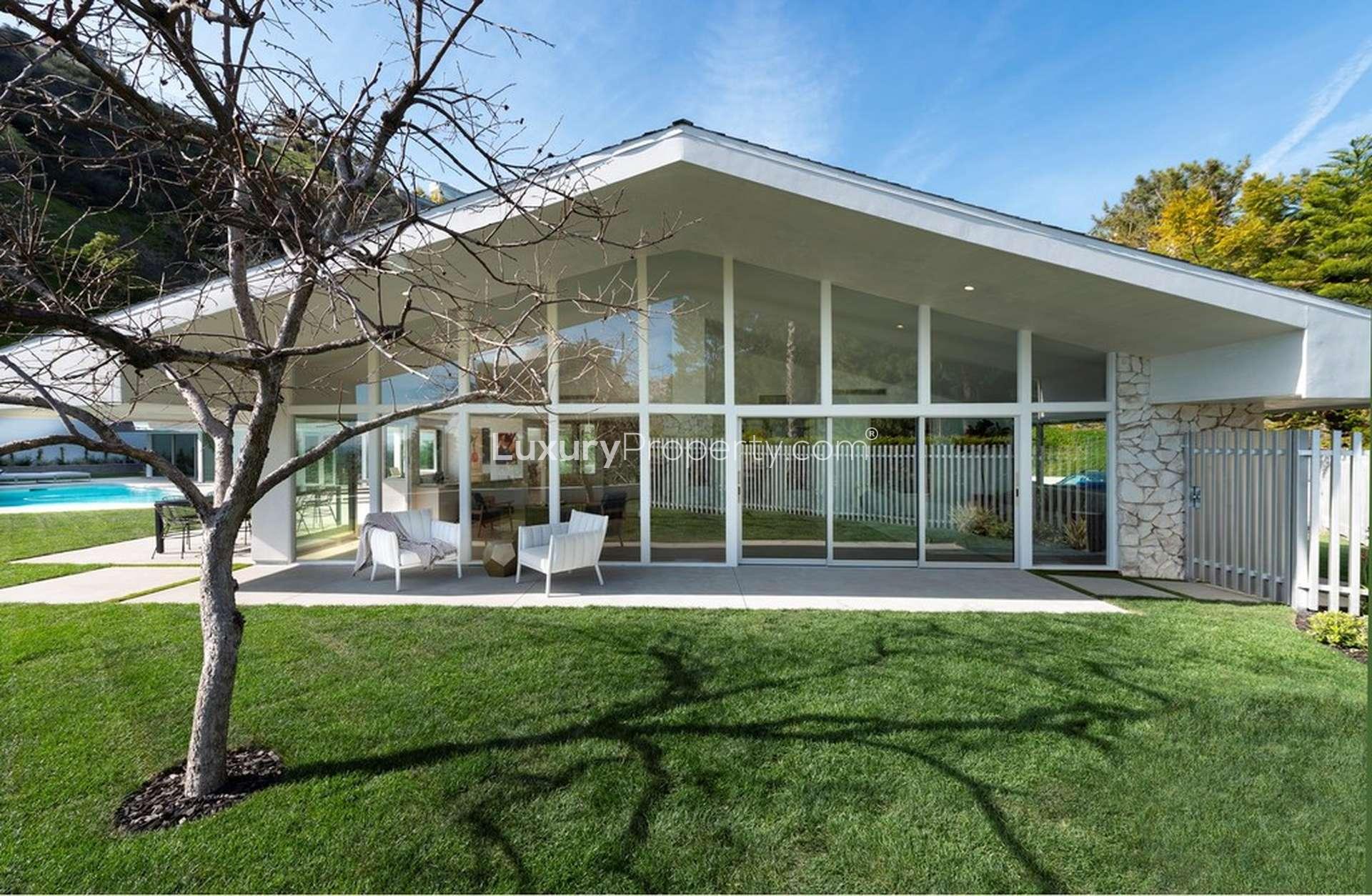 Ocean view villa with pool and patio at dusk, Los Angeles real estate