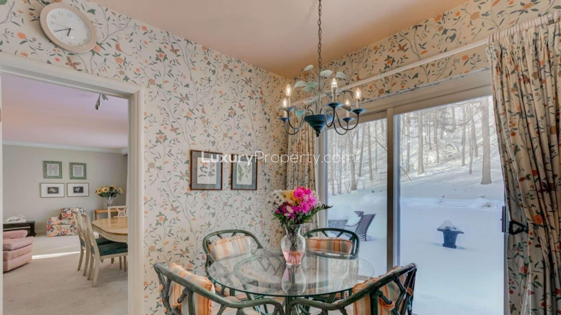 Living room of 4-bedroom villa in York Mills, Toronto, featuring elegant decor and fireplace