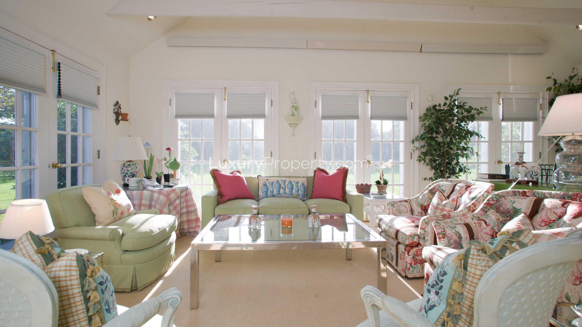 "Charming 4-bedroom villa entrance with white picket fence in Southampton, Hamptons, NY.",Charming living room in 4-bedroom villa, 300 Murray Place, Southampton, Hamptons, for sale