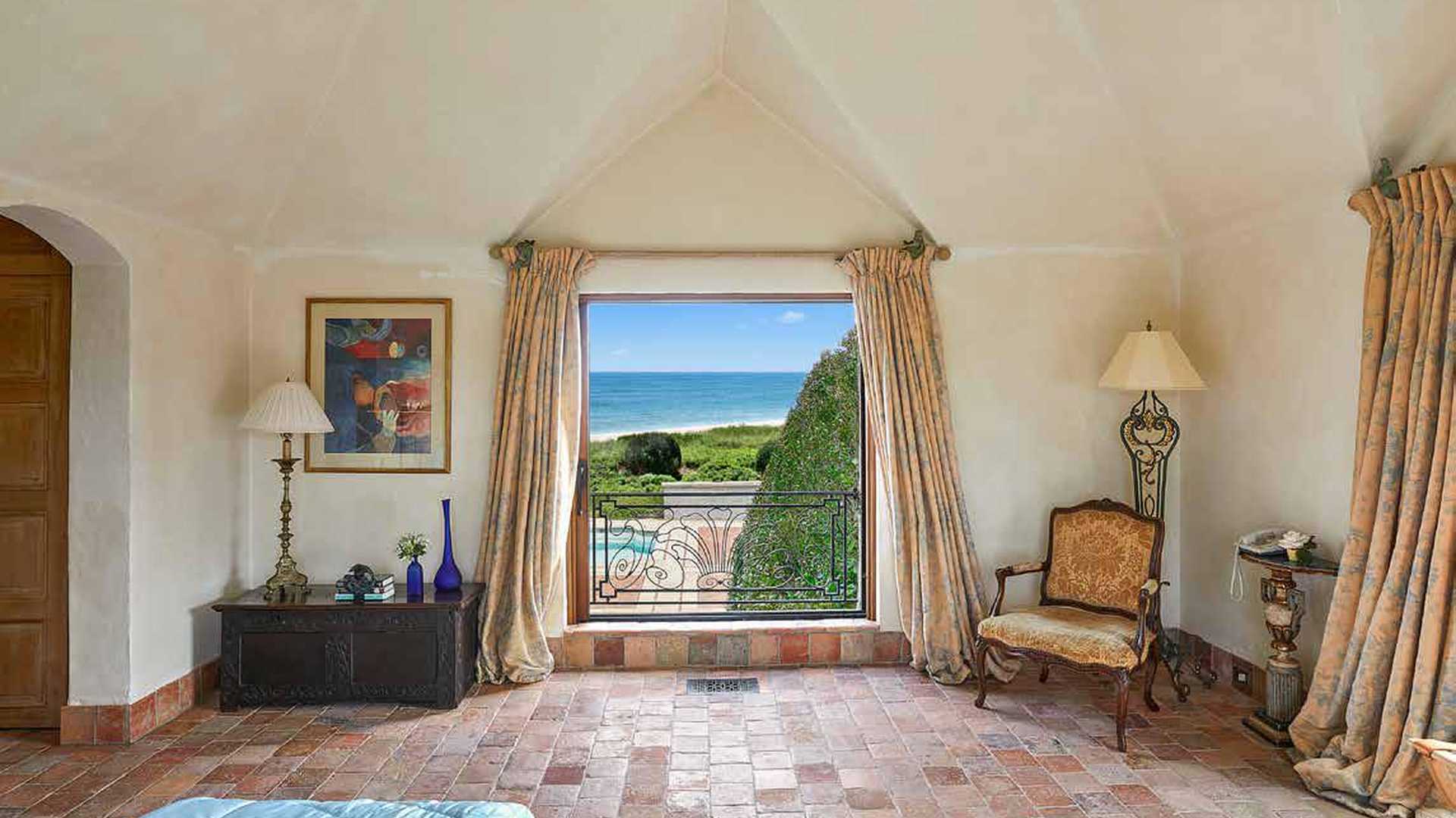 Aerial view of beachfront villa with pool in Hamptons, New York