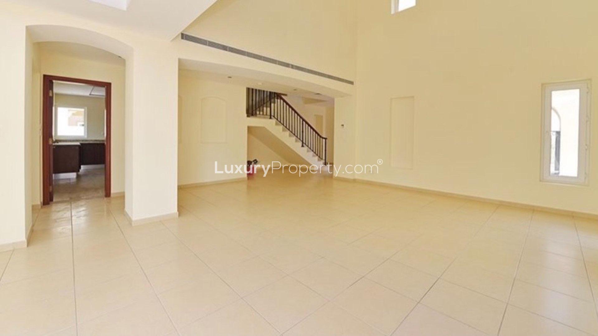 Immaculate 4-bedroom villa exterior in Al Mahra, Arabian Ranches, with spacious driveway