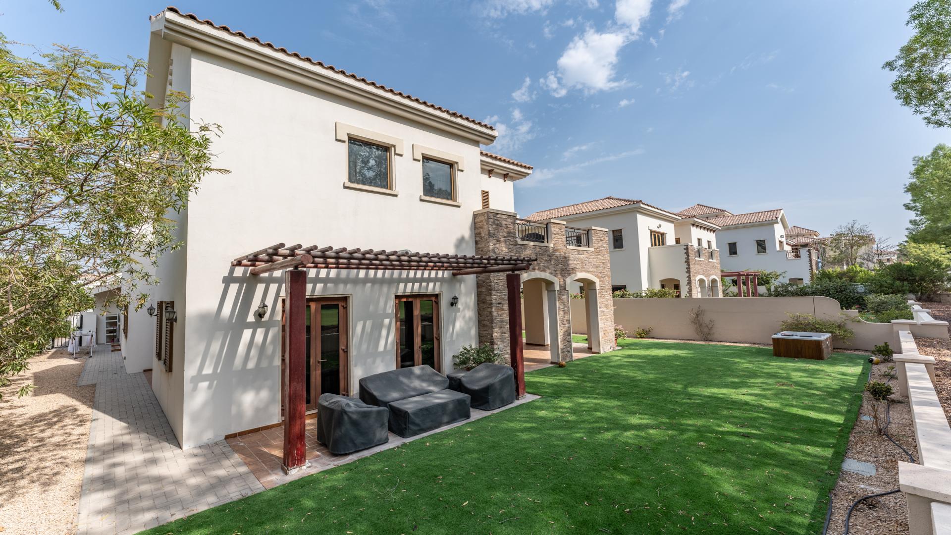 "Luxurious villa garden with golf course views in Jumeirah Golf Estates, Earth community.",Villa with pergola and landscaped yard in Jumeirah Golf Estates, Earth community, for sale