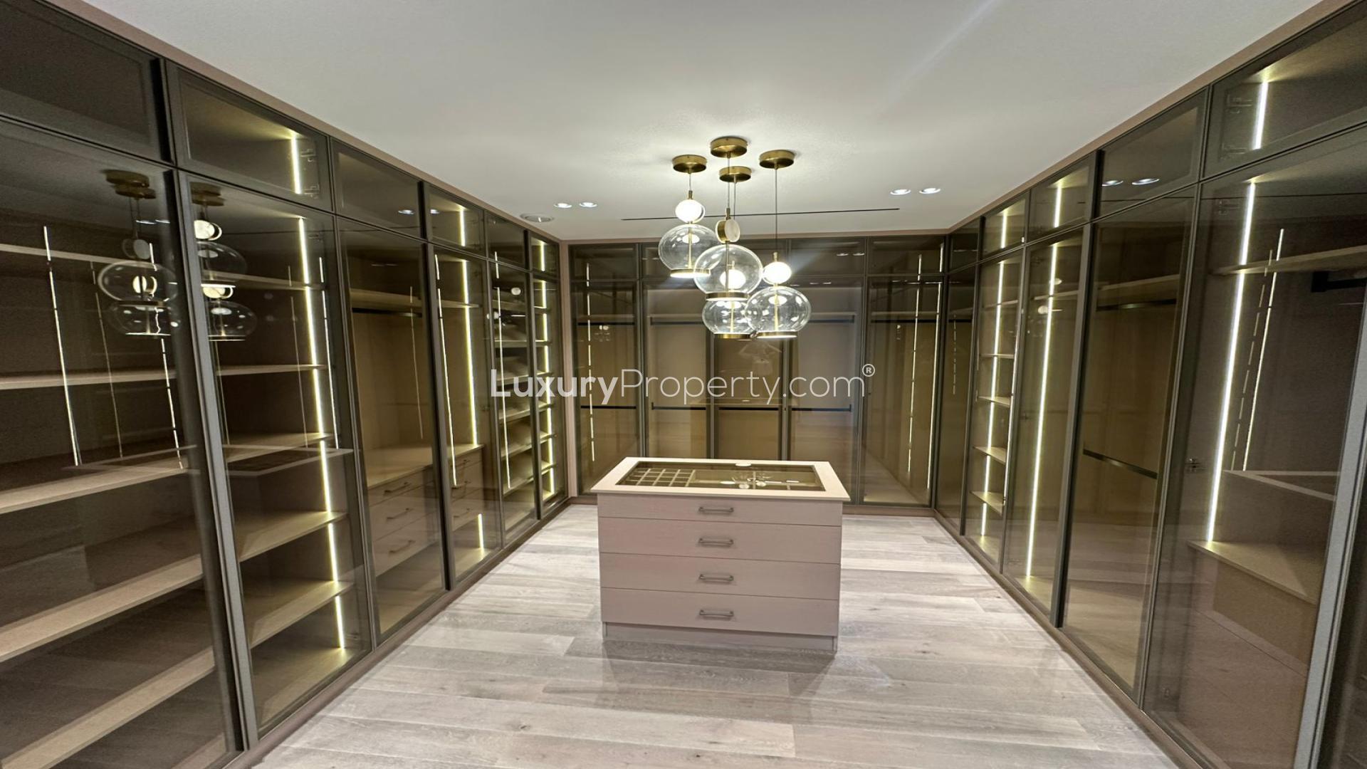 Luxury dining area in Jumeirah Golf Estates villa with modern decor and elegant lighting