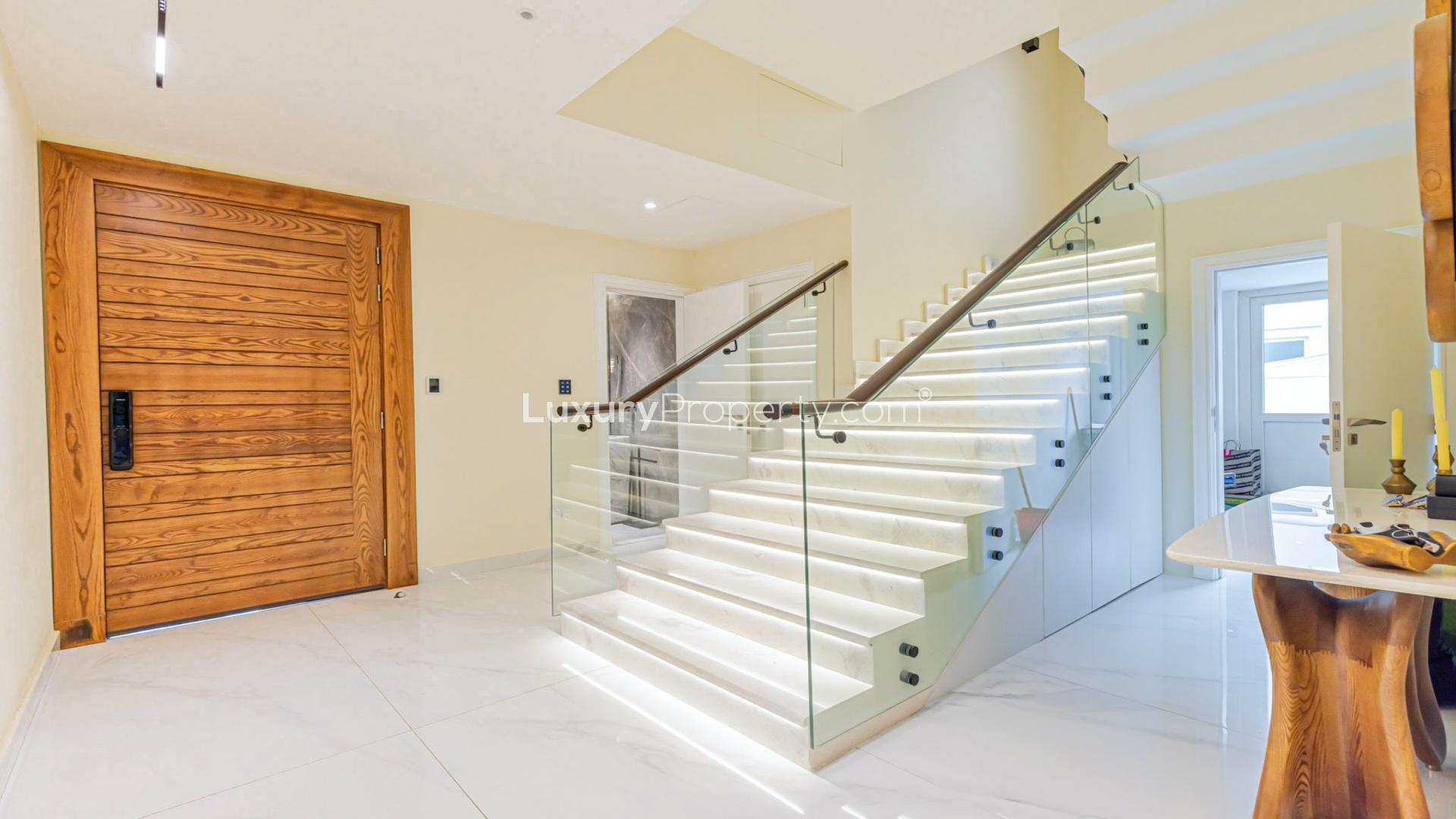 Luxurious Victory Heights villa with private pool, lush garden, and modern design in Dubai Sports City